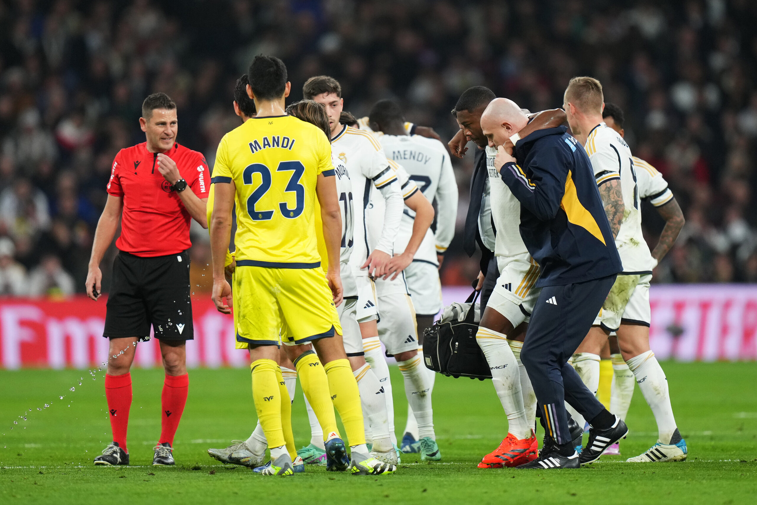 MADRID, SPAIN - DECEMBER 17: David Alaba of Real Madrid leaves the pitch after an injury during the LaLiga EA Sports match between Real Madrid CF and Villarreal CF at Estadio Santiago Bernabeu on December 17, 2023 in Madrid, Spain.