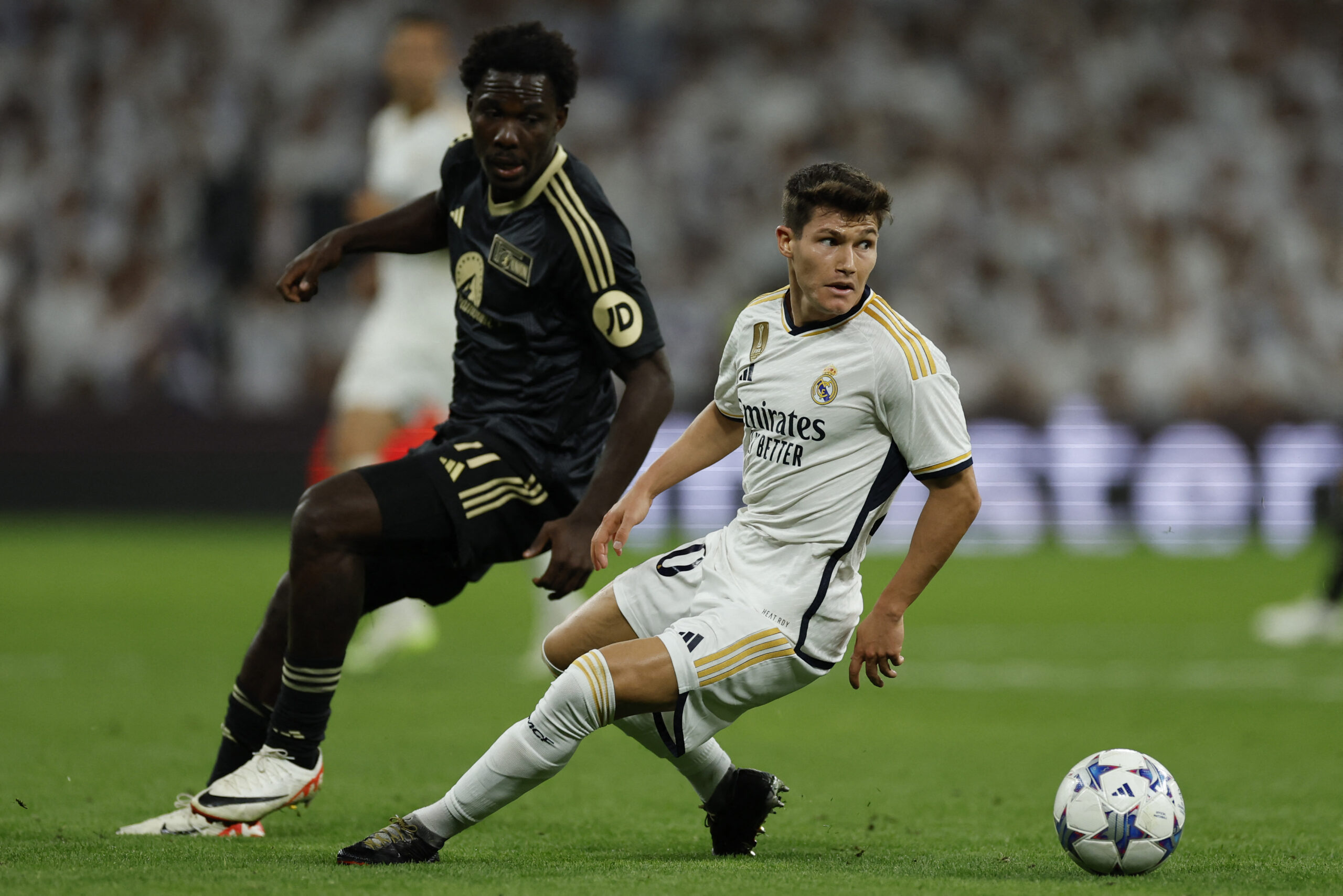 Union Berlin's Ivorian forward #11 David Datro Fofana (L) vies with Real Madrid's Spanish defender #20 Fran Garcia during the UEFA Champions League 1st round day 1 group C football match between Real Madrid and Union Berlin at the Santiago Bernabeu stadium in Madrid on September 20, 2023.