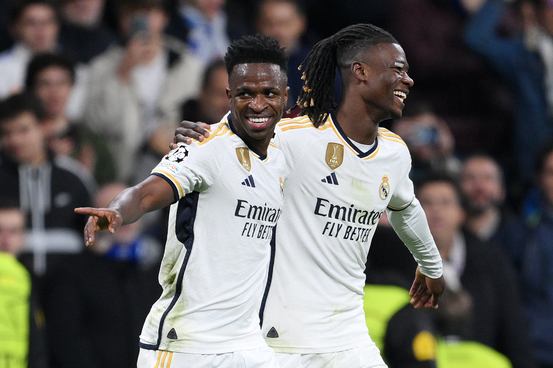 MADRID, SPAIN - NOVEMBER 08: Vinicius Junior of Real Madrid (L) celebrates after scoring the team's second goal with teammate Eduardo Camavinga during the UEFA Champions League match between Real Madrid and SC Braga at Estadio Santiago Bernabeu on November 08, 2023 in Madrid, Spain.
