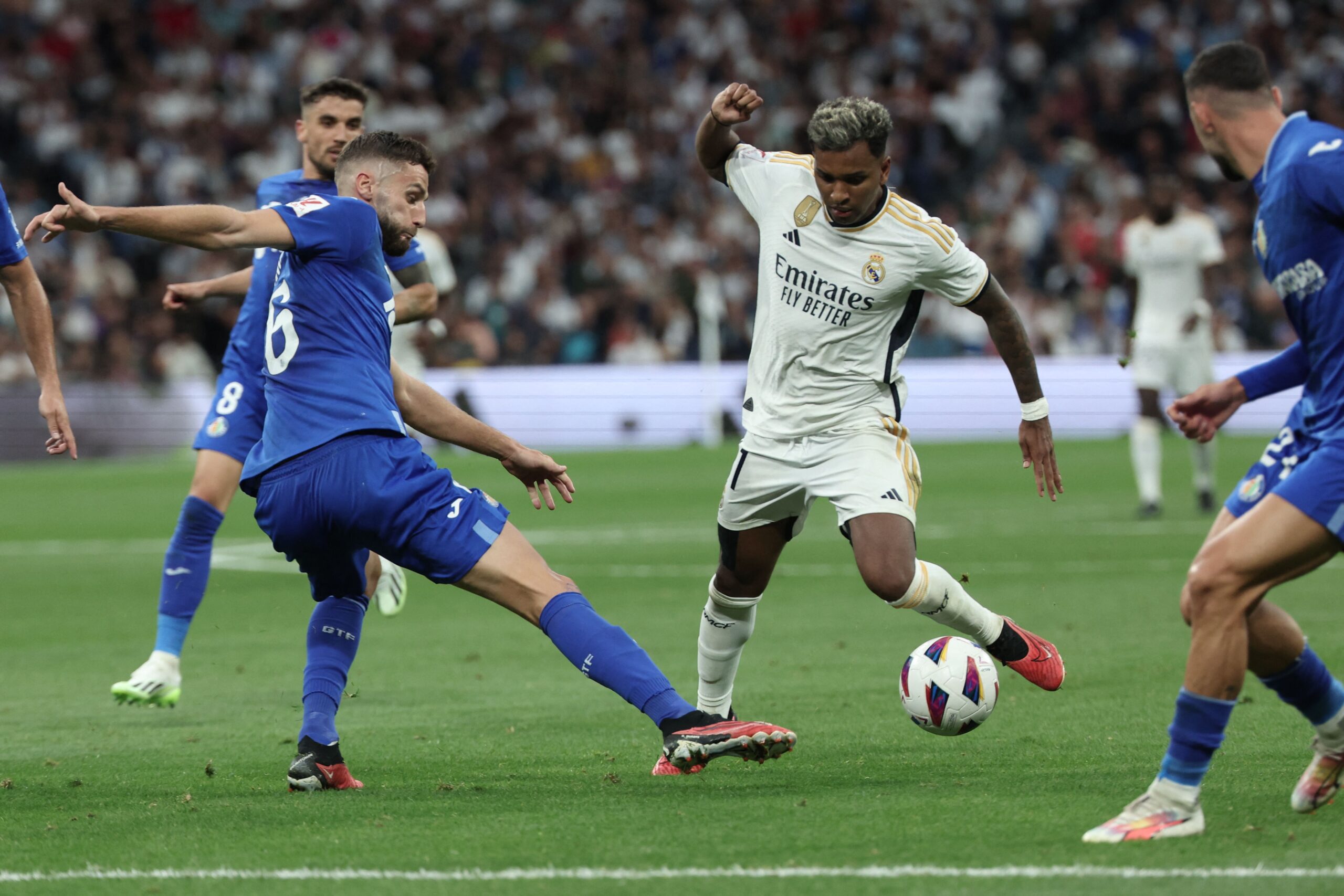 Real Madrid's Brazilian forward #11 Rodrygo controls the ball during the Spanish Liga football match between Real Madrid CF and Getafe CF at the Santiago Bernabeu stadium in Madrid on September 2, 2023.