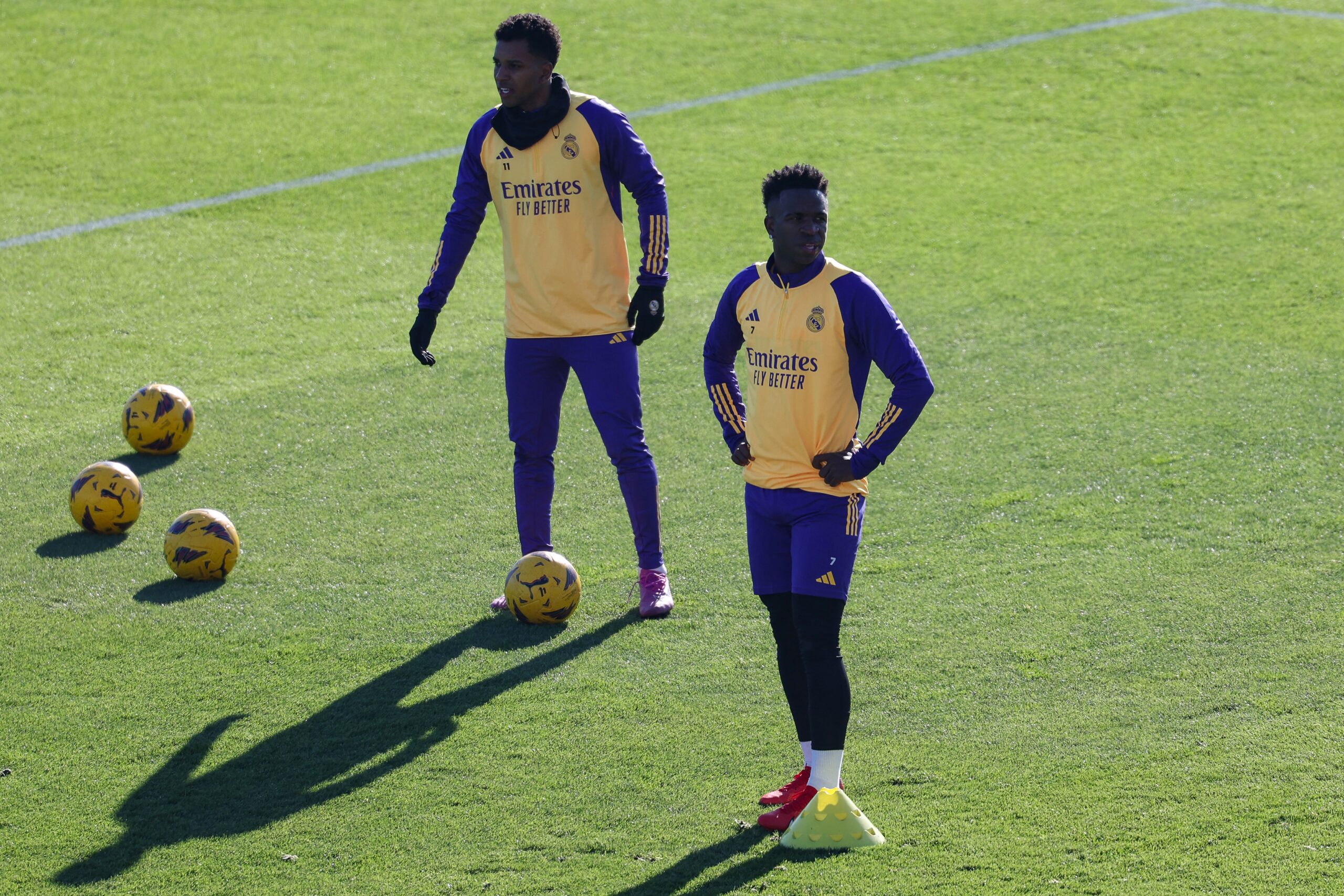 Real Madrid's Brazilian forward #11 Rodrygo (L) and Real Madrid's Brazilian forward #07 Vinicius Junior attend a training session at the Ciudad Real Madrid training ground in Valdebebas, Madrid, on December 30, 2023.