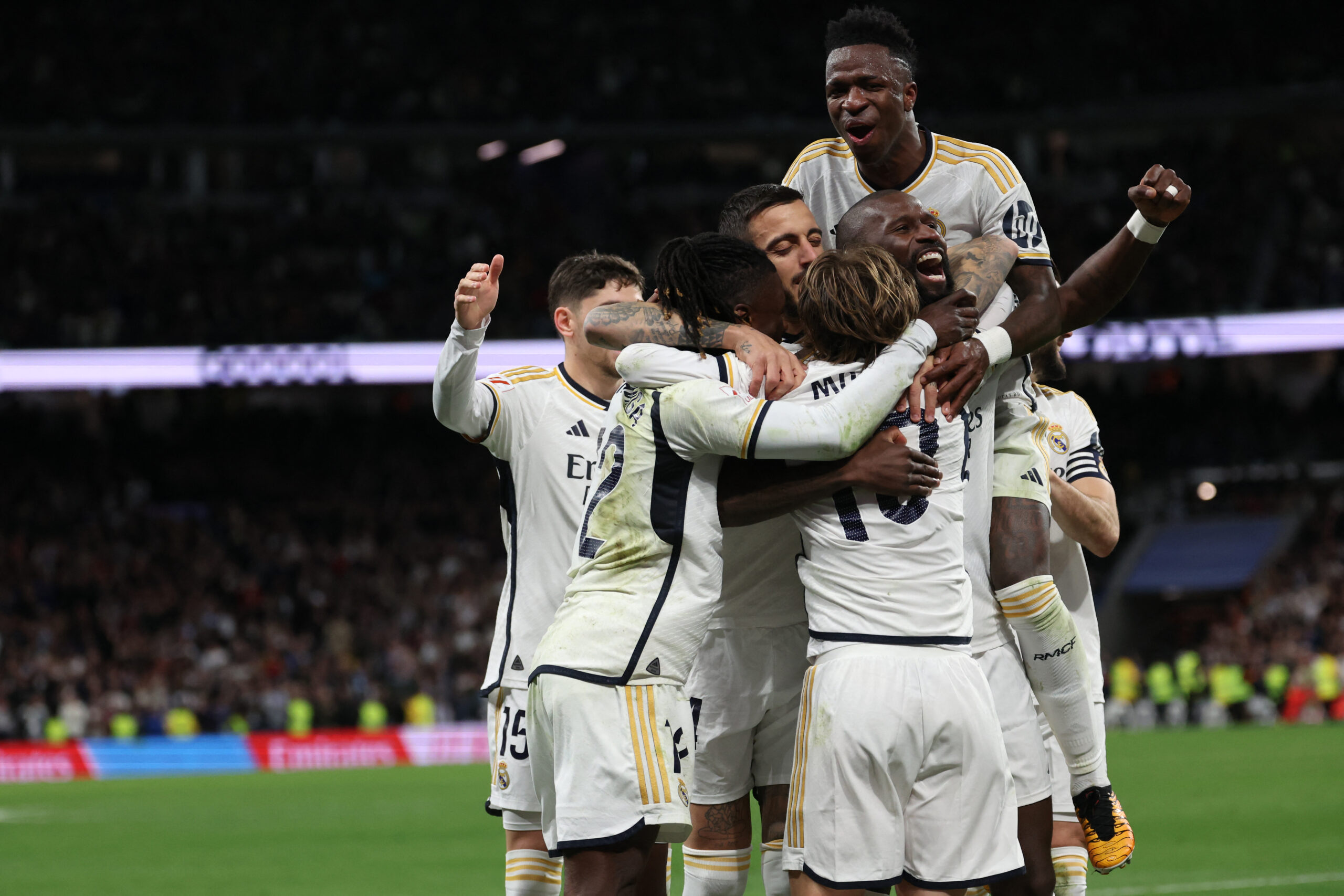 Real Madrid players react to Celta's owngoal during the Spanish league football match between Real Madrid CF and RC Celta de Vigo at the Santiago Bernabeu stadium in Madrid on March 10, 2024.
