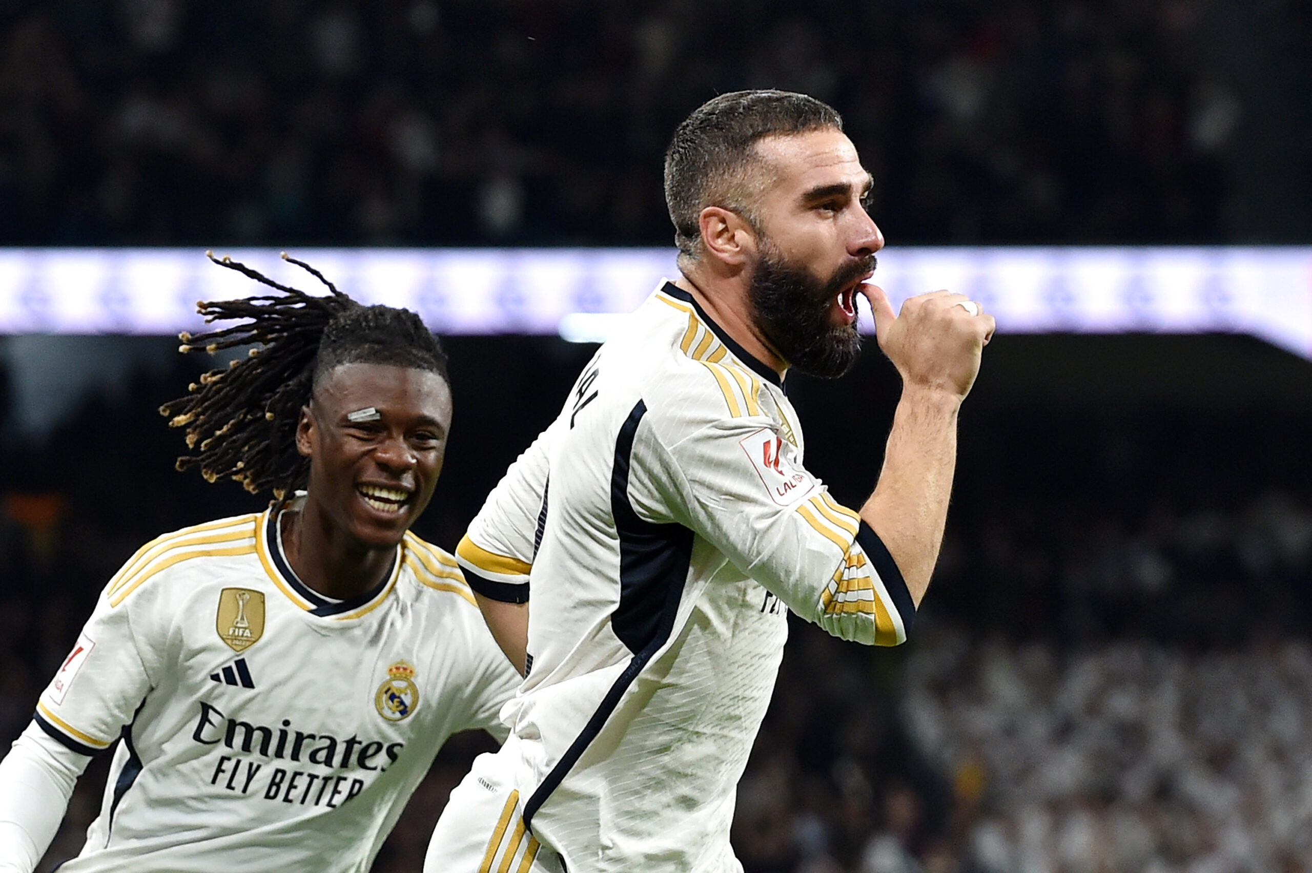 MADRID, SPAIN - NOVEMBER 11: Daniel Carvajal of Real Madrid (R) celebrates with teammate Eduardo Camavinga after scoring the team's first goal during the LaLiga EA Sports match between Real Madrid CF and Valencia CF at Estadio Santiago Bernabeu on November 11, 2023 in Madrid, Spain.