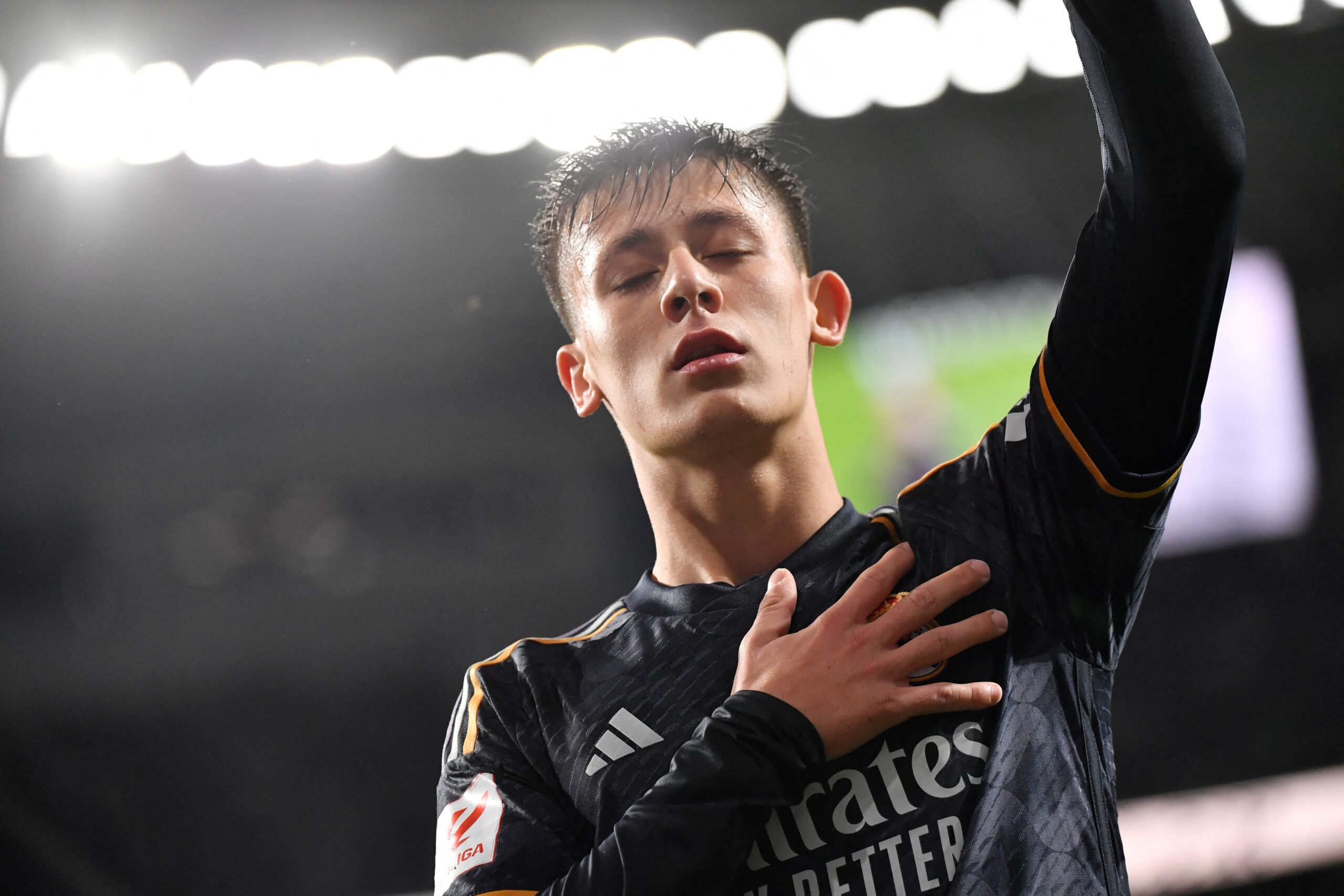 Real Madrid's Turkish midfielder #24 Arda Guler celebrates scoring his team's first goal during the Spanish league football match between Real Sociedad and Real Real Madrid CF at the Anoeta stadium in San Sebastian on April 26, 2024.