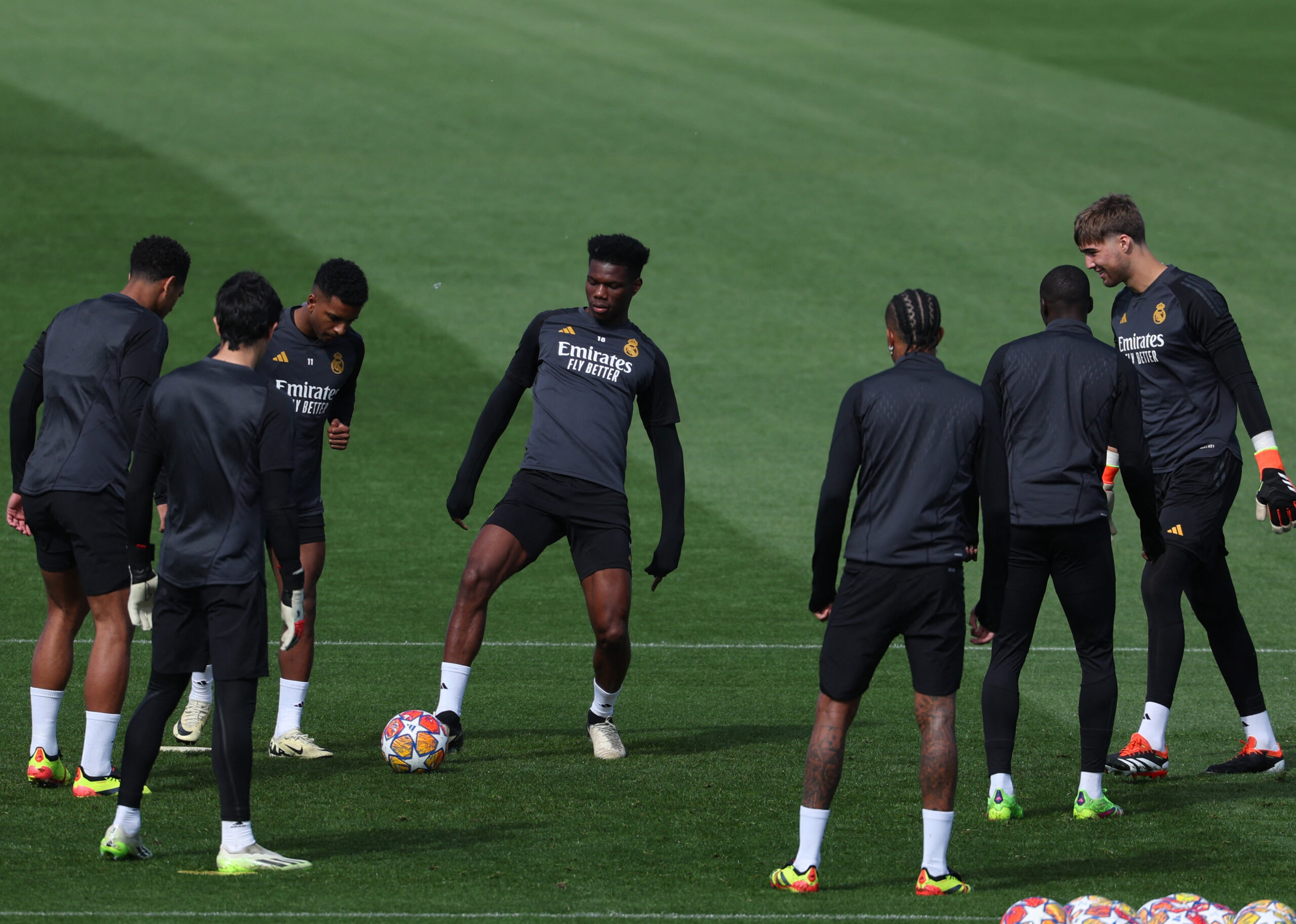 Real Madrid's French defender #18 Aurelien Tchouameni (C) kicks the ball during a training session on the eve of their UEFA Champions League quarter final first leg football match against Manchester City at the Real Madrid Sport City in Valdebebas, on the outskirts of Madrid, on April 8, 2024.