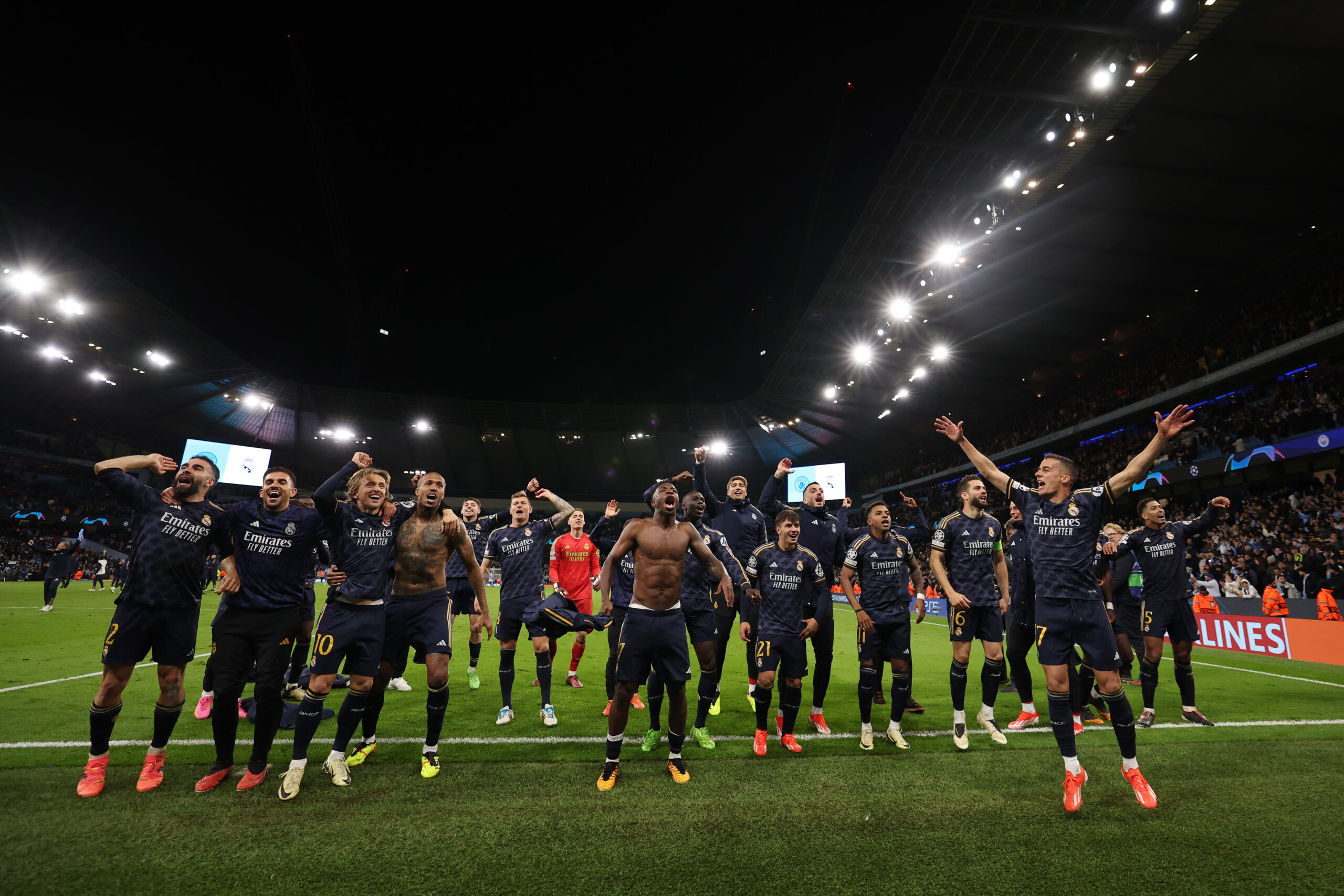 MANCHESTER, ENGLAND - APRIL 17: Real Madrid players celebrate with the fans after the team's victory in the penalty shoot out during the UEFA Champions League quarter-final second leg match between Manchester City and Real Madrid CF at Etihad Stadium on April 17, 2024 in Manchester, England.