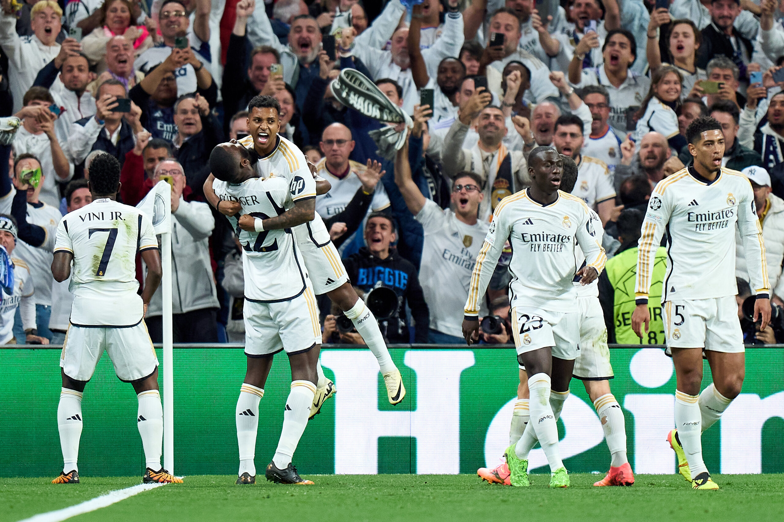 MADRID, SPAIN - APRIL 09: Rodrygo of Real Madrid celebrates scoring his team's second goal with teammate Antonio Rudiger during the UEFA Champions League quarter-final first leg match between Real Madrid CF and Manchester City at Estadio Santiago Bernabeu on April 09, 2024 in Madrid, Spain.