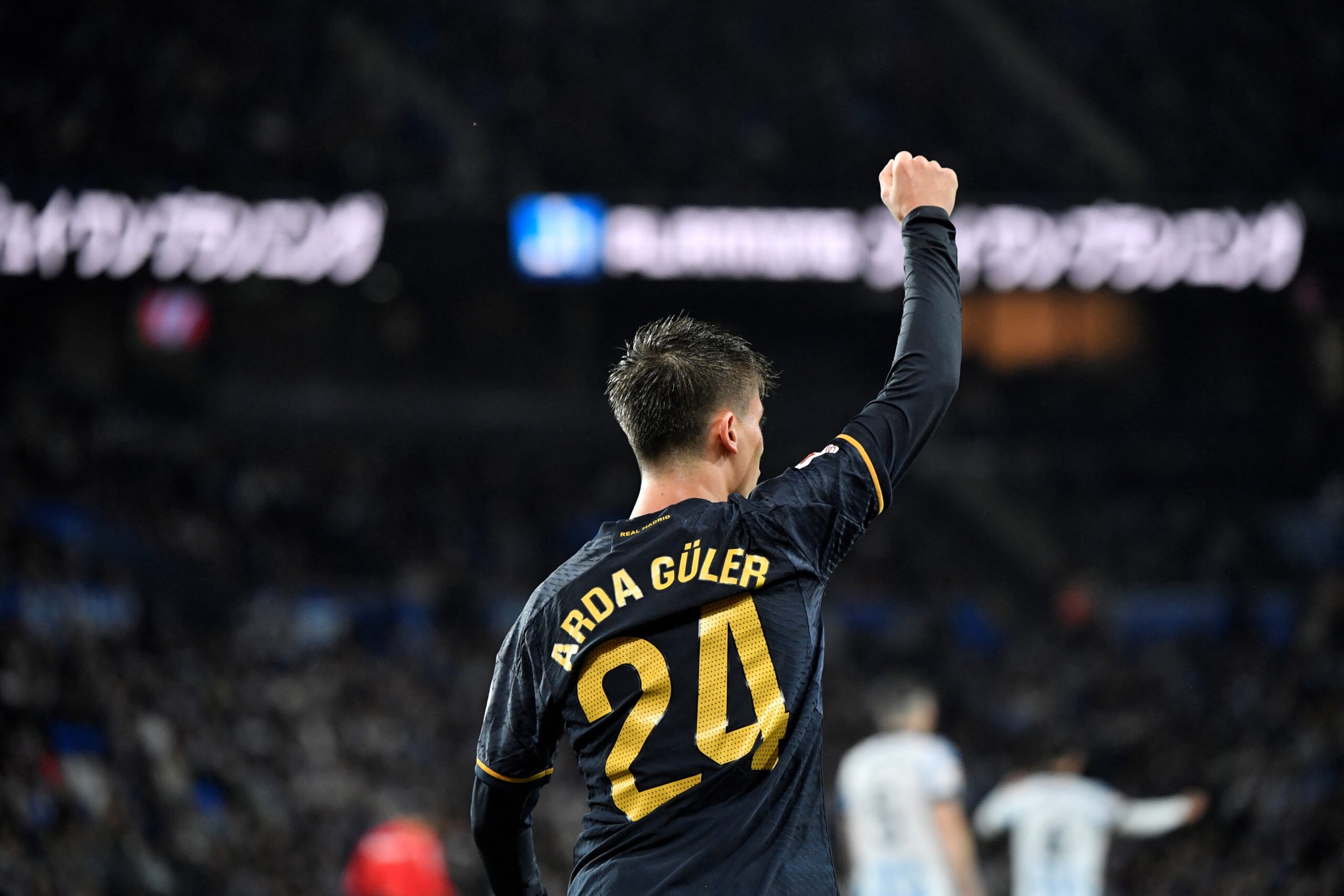 TOPSHOT - Real Madrid's Turkish midfielder #24 Arda Guler celebrates scoring his team's first goal during the Spanish league football match between Real Sociedad and Real Real Madrid CF at the Anoeta stadium in San Sebastian on April 26, 2024.