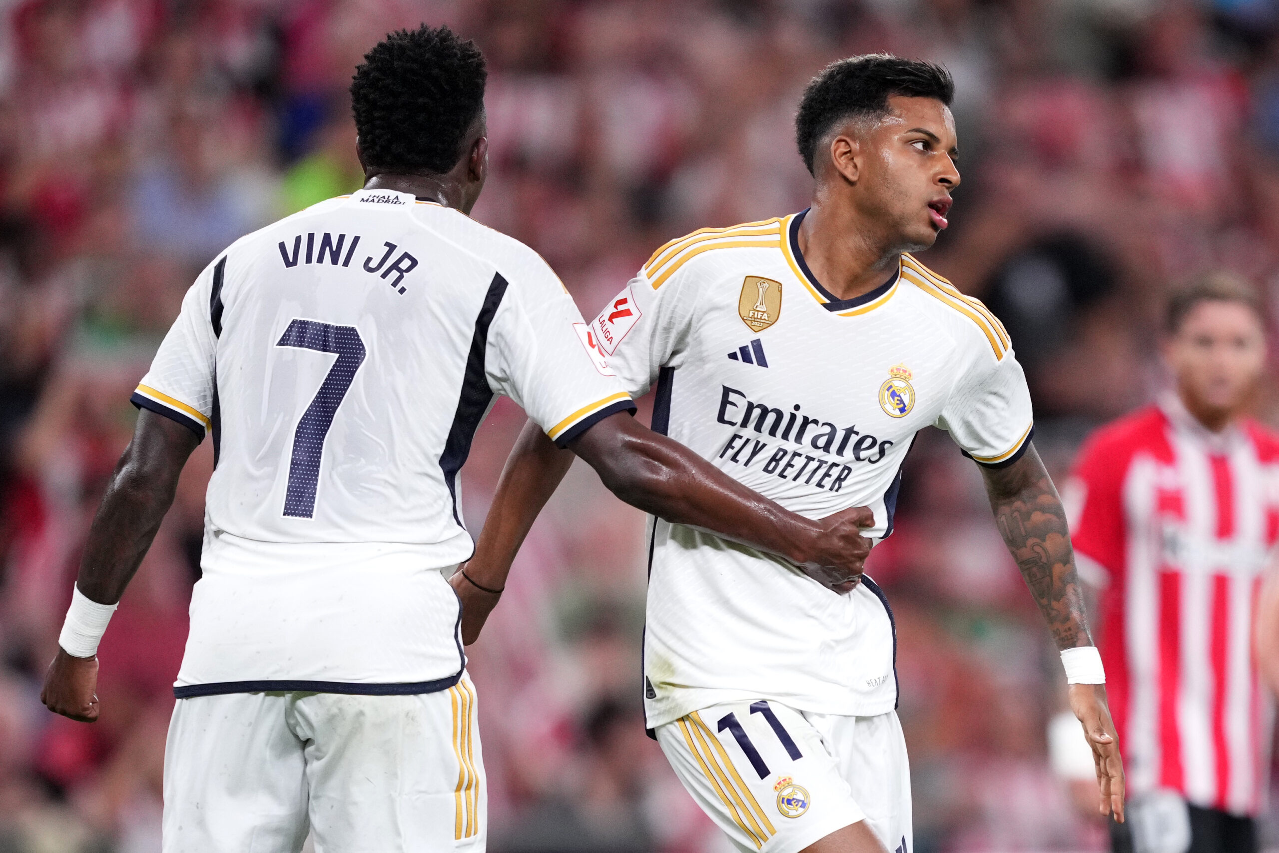 BILBAO, SPAIN - AUGUST 12: Vinicius Junior of Real Madrid interacts with teammate Rodrygo during the LaLiga EA Sports match between Athletic Club and Real Madrid CF at Estadio de San Mames on August 12, 2023 in Bilbao, Spain.