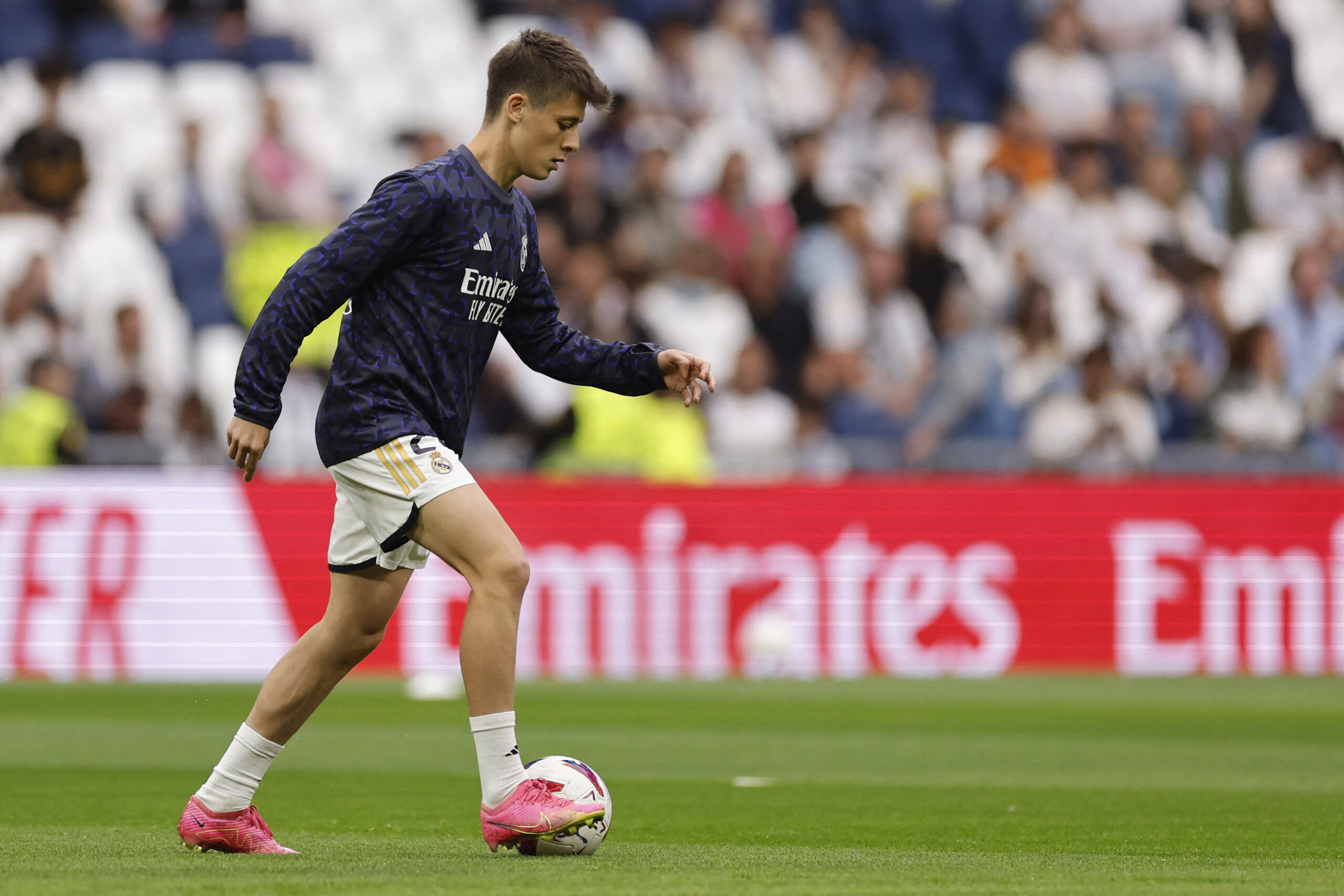CORRECTION / Real Madrid's Turkish midfielder #24 Arda Guler warms up before the Spanish league football match between Real Madrid CF and Cadiz CF at the Santiago Bernabeu stadium in Madrid on May 4, 2024.