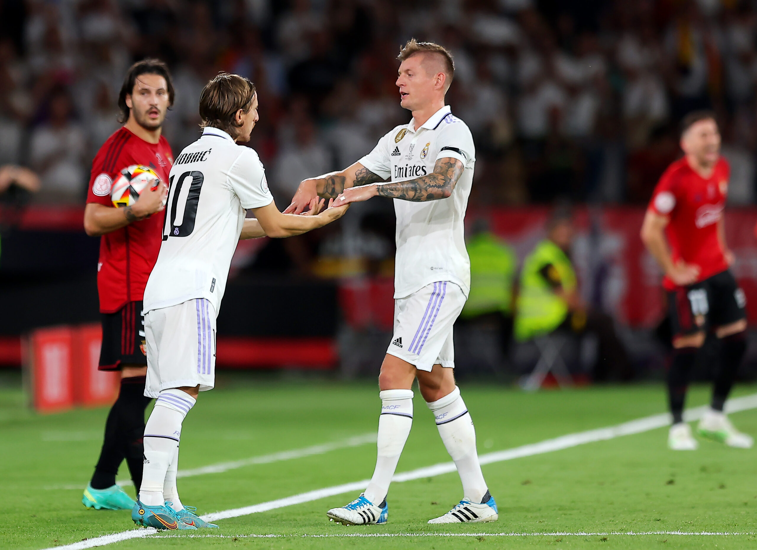SEVILLE, SPAIN - MAY 06: Toni Kroos of Real Madrid is replaced by substitute Luka Modric during the Copa del Rey Final match between Real Madrid and CA Osasuna at Estadio de La Cartuja on May 06, 2023 in Seville, Spain.