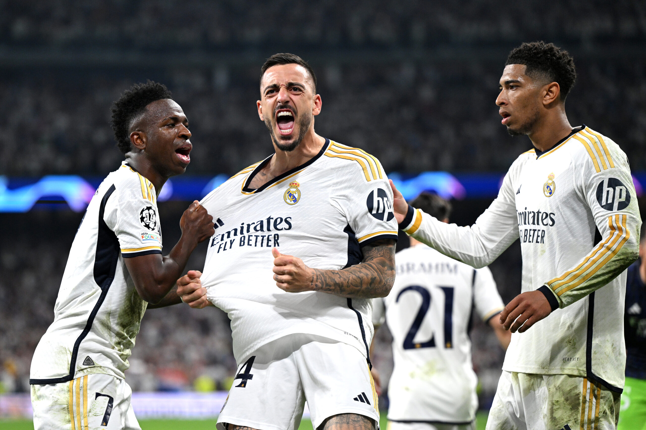 MADRID, SPAIN - MAY 08: Joselu of Real Madrid celebrates scoring his team's first goal with Vinicius Junior and Jude Bellingham during the UEFA Champions League semi-final second leg match between Real Madrid and FC Bayern München at Estadio Santiago Bernabeu on May 08, 2024 in Madrid, Spain.