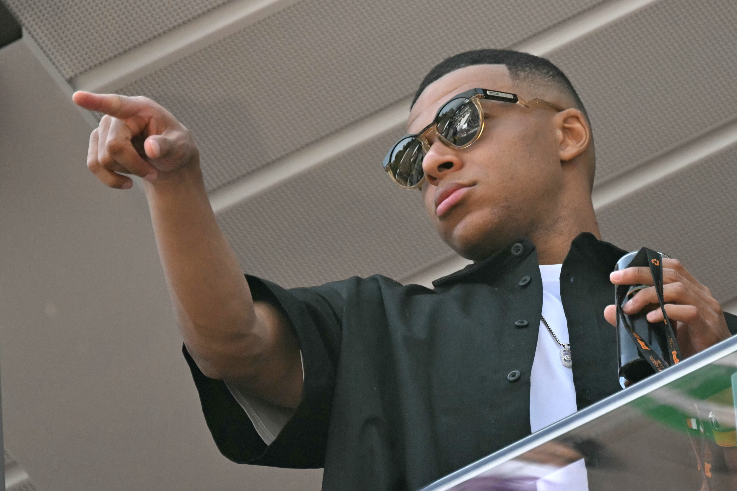 Paris Saint-Germain's French forward Kylian Mbappe stands on the balcony in the pit lane of the Circuit de Monaco ahead of the Formula One Monaco Grand Prix on May 26, 2024.