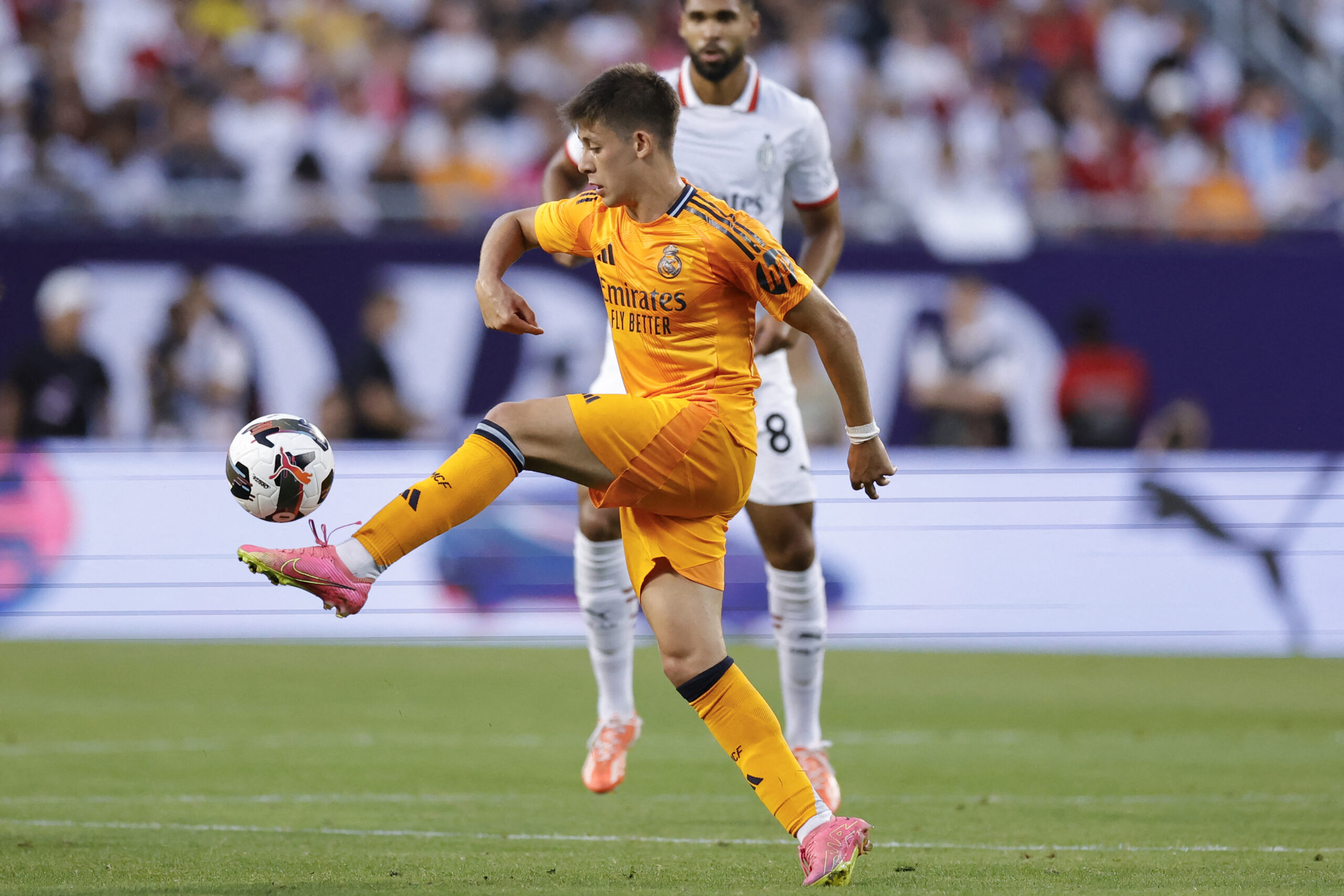 Real Madrid's midfielder #15 Arda Guler controls the ball during the first half of the pre-season club friendly football match between AC Milan and Real Madrid at Soldier Field in Chicago, Illinois, on July 31 2024.