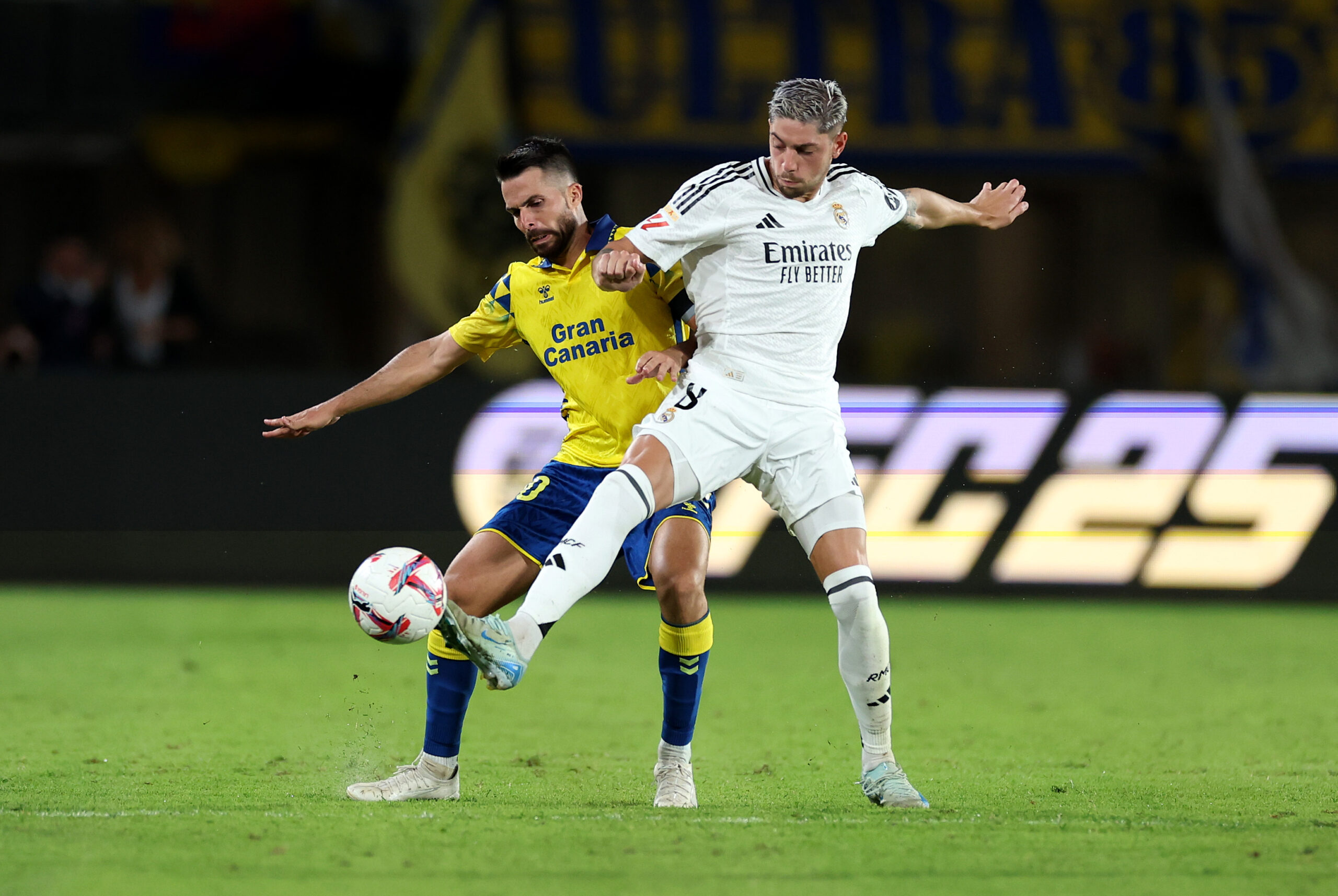 LAS PALMAS, SPAIN - AUGUST 29: Federico Valverde of Real Madrid is challenged by Kirian Rodriguez of UD Las Palmas during the La Liga match between UD Las Palmas and Real Madrid CF at Estadio Gran Canaria on August 29, 2024 in Las Palmas, Spain.