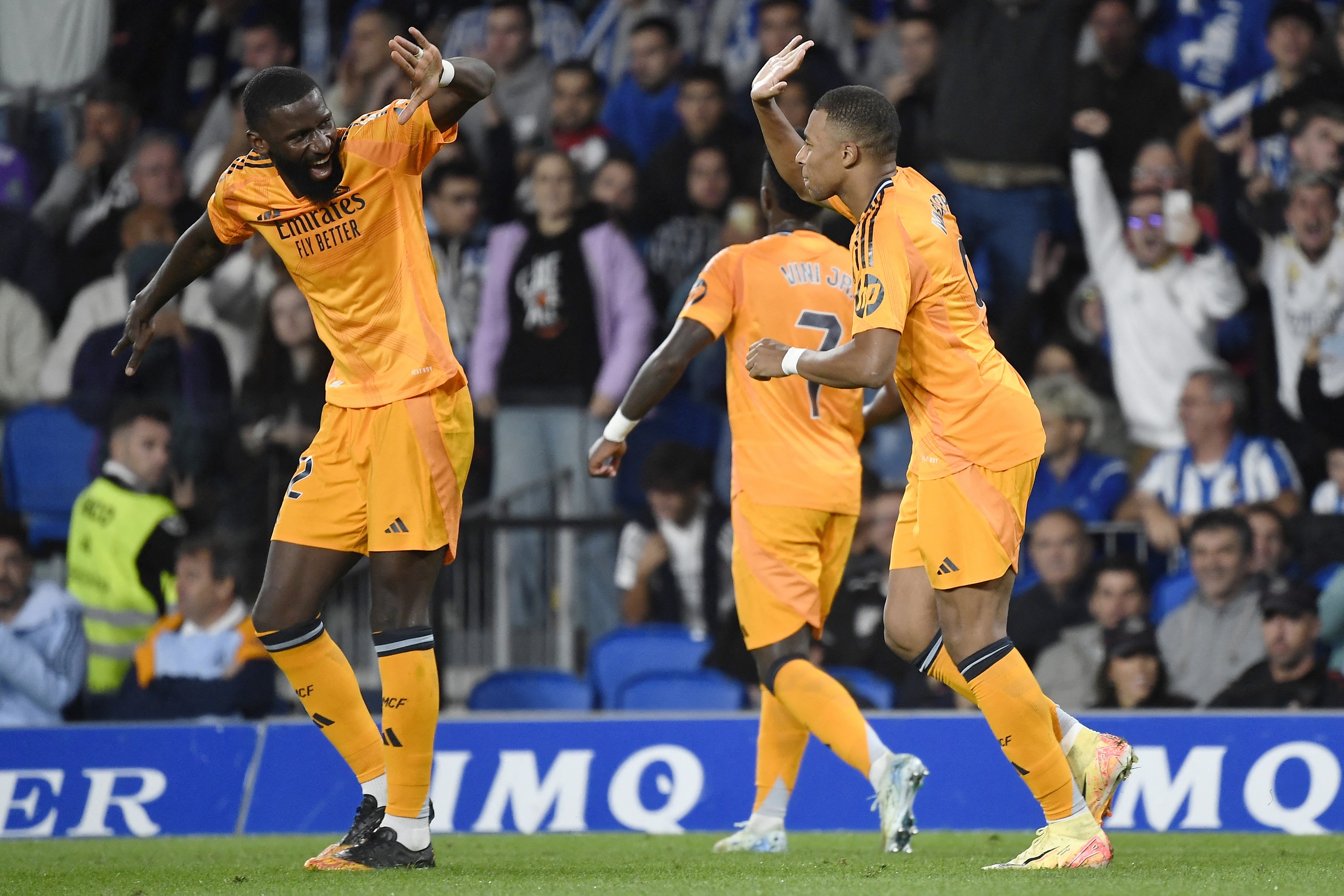 Real Madrid's French forward #09 Kylian Mbappe celebrates scoring his team's second goal, from the penalty spot, with Real Madrid's German defender #22 Antonio Ruediger, during the Spanish league football match between Real Sociedad and Real Madrid CF at the Anoeta stadium in San Sebastian on September 14, 2024.