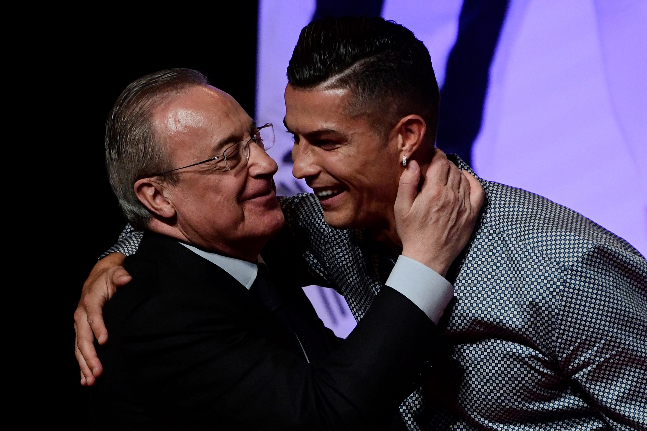 Portugal and Juventus forward Cristiano Ronaldo is congratulated by his former club Real Madrid's president Florentino Perez (L) after receiving the MARCA Leyenda (MARCA Legend) award in Madrid on July 29, 2019. - The award is attributed to sport professionals by the Spanish sports newspaper MARCA.