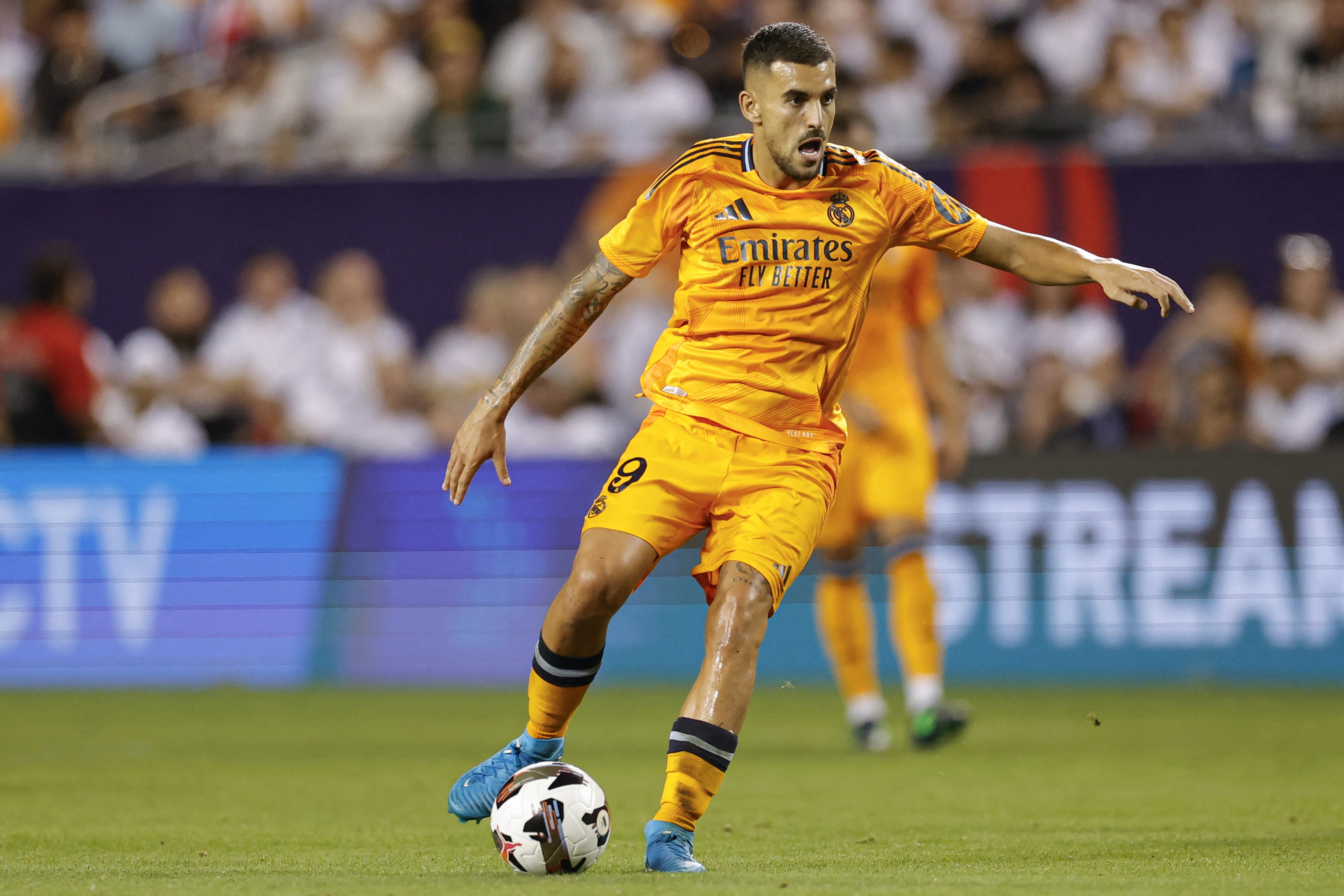 Real Madrid's midfielder #19 Dani Ceballos controls the ball during the second half of the pre-season club friendly football match between AC Milan and Real Madrid at Soldier Field in Chicago, Illinois on July 31, 2024.