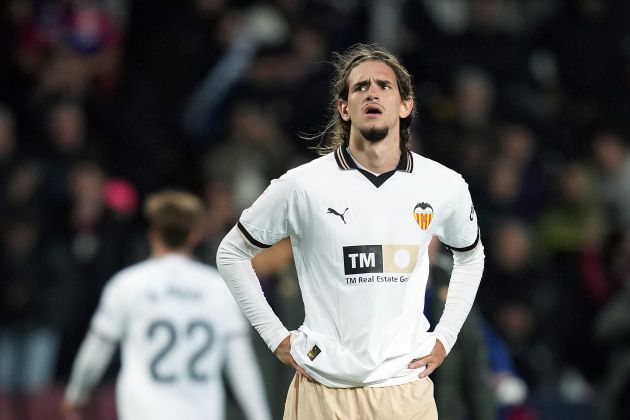 BARCELONA, SPAIN - APRIL 29: Yarek Gasiorowski of Valencia CF reacts at full-time following the team's defeat in the LaLiga EA Sports match between FC Barcelona and Valencia CF at Estadi Olimpic Lluis Companys on April 29, 2024 in Barcelona, Spain.
