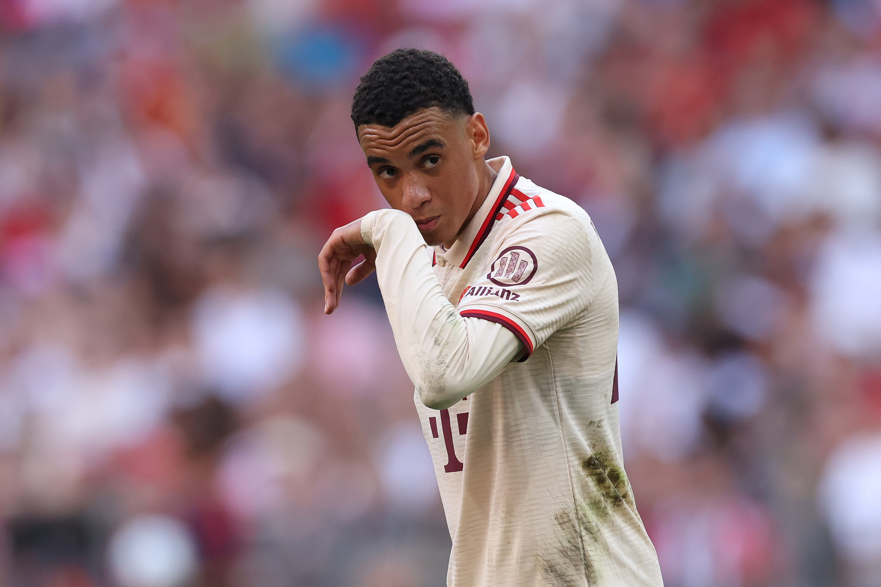 MUNICH, GERMANY - SEPTEMBER 01: Jamal Musiala of FC Bayern München looks on during the Bundesliga match between FC Bayern München and Sport-Club Freiburg at Allianz Arena on September 01, 2024 in Munich, Germany.