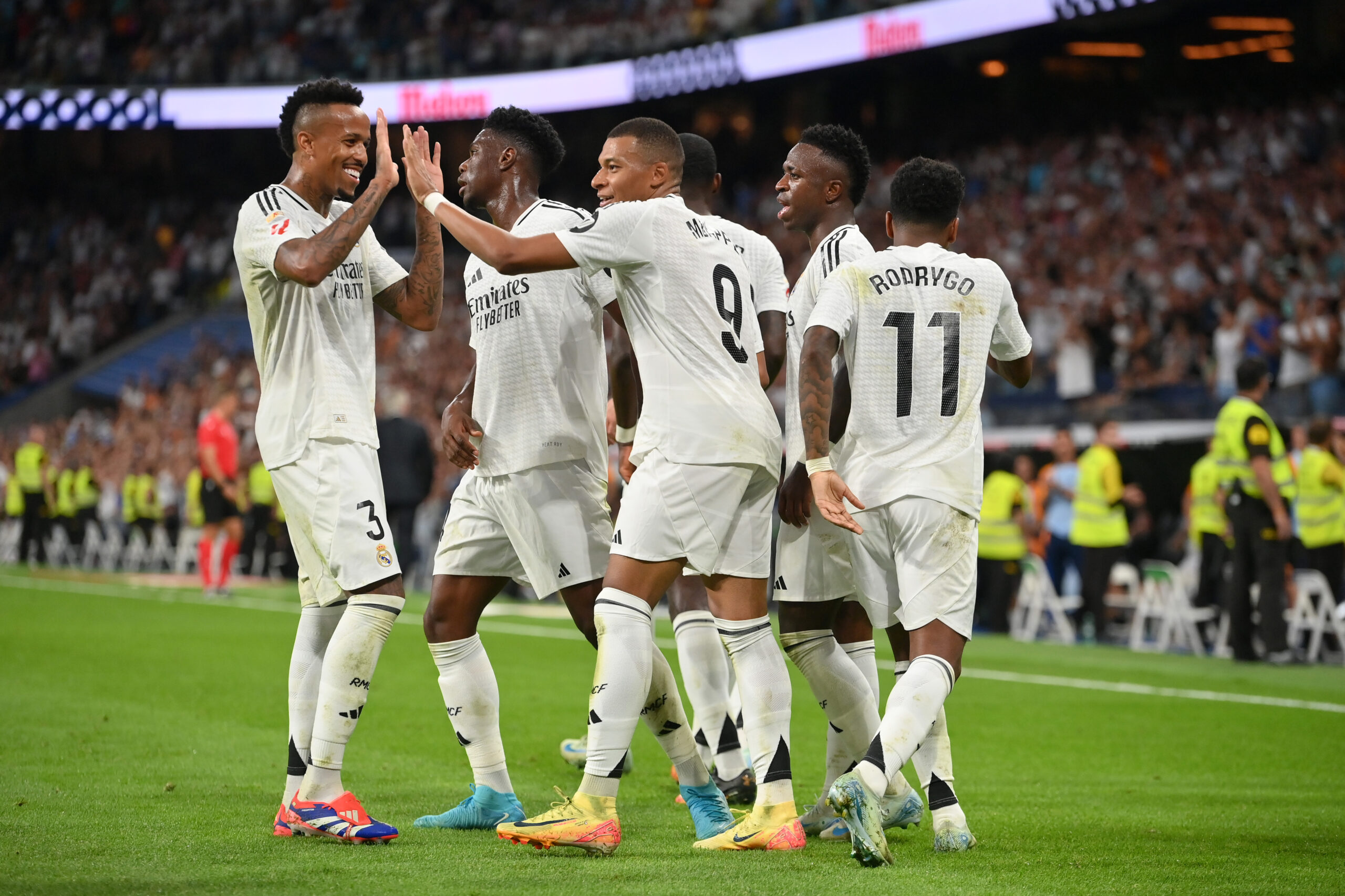 MADRID, SPAIN - SEPTEMBER 01: Kylian Mbappe of Real Madrid (C) celebrates scoring his team's first goal with teammates Eder Militao, Vinicius Junior and Rodrygo during the LaLiga match between Real Madrid CF and Real Betis Balompie at Estadio Santiago Bernabeu on September 01, 2024 in Madrid, Spain.