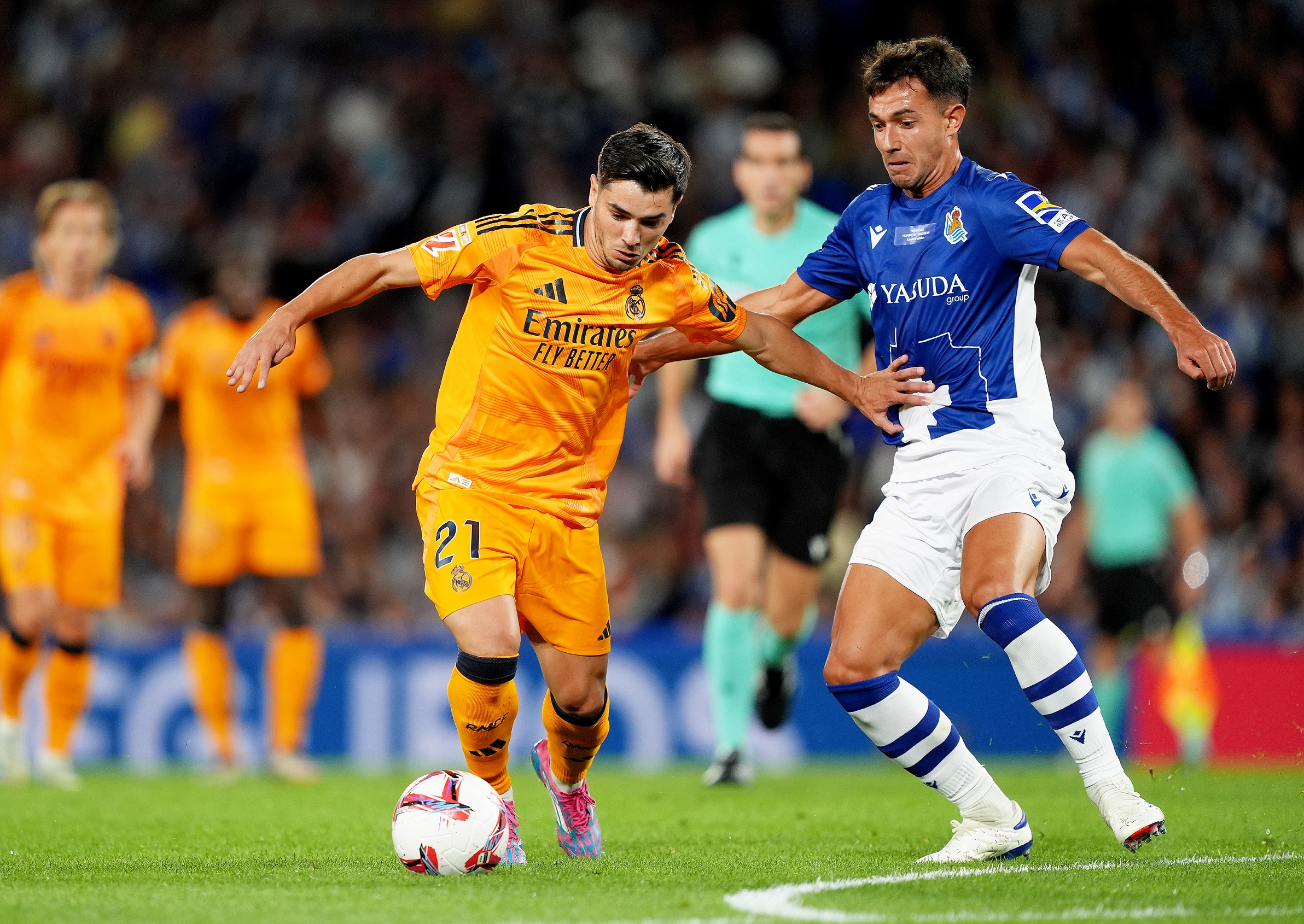 SAN SEBASTIAN, SPAIN - SEPTEMBER 14: Brahim Diaz of Real Madrid is challenged by Martin Zubimendi of Real Sociedad during the LaLiga match between Real Sociedad and Real Madrid CF at Reale Arena on September 14, 2024 in San Sebastian, Spain.