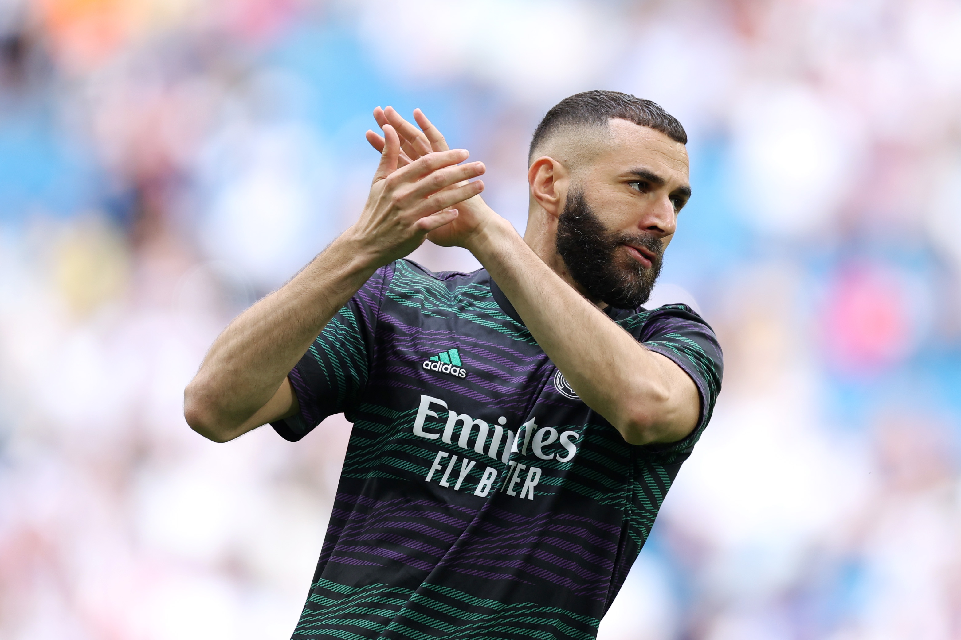 MADRID, SPAIN - JUNE 04: Karim Benzema of Real Madrid applauds the fans during the warm up prior to the LaLiga Santander match between Real Madrid CF and Athletic Club at Estadio Santiago Bernabeu on June 04, 2023 in Madrid, Spain.