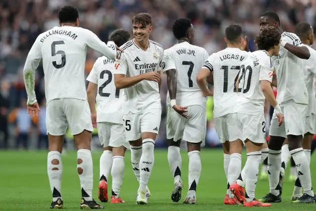 NOVEMBER 09: Jude Bellingham (L) of Real Madrid CF celebrates scoring their second goal with teammate Raul Asencio (2ndL) during the LaLiga match between Real Madrid CF and CA Osasuna at Estadio Santiago Bernabeu on November 09, 2024 in Madrid, Spain.