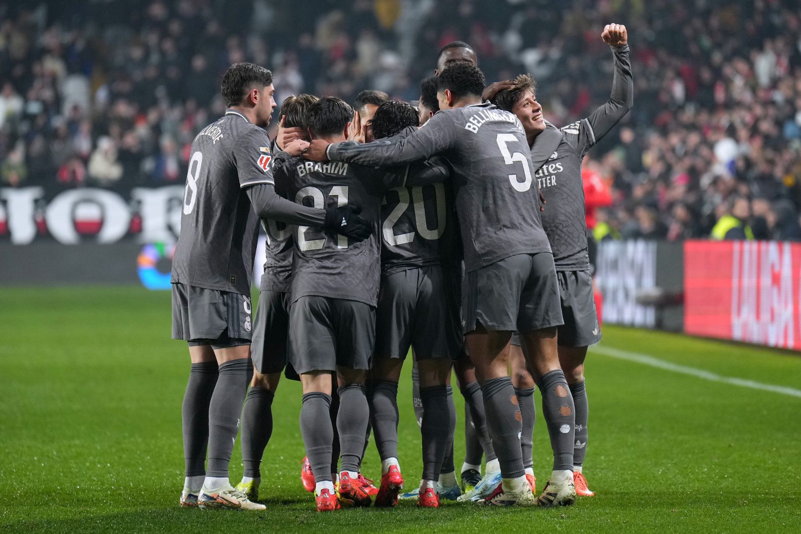 MADRID, SPAIN - DECEMBER 14: Rodrygo of Real Madrid (obscured) celebrates with his teammates after scoring his team's third goal during the LaLiga EA Sports match between Rayo Vallecano and Real Madrid at Estadio de Vallecas on December 14, 2024 in Madrid, Spain.