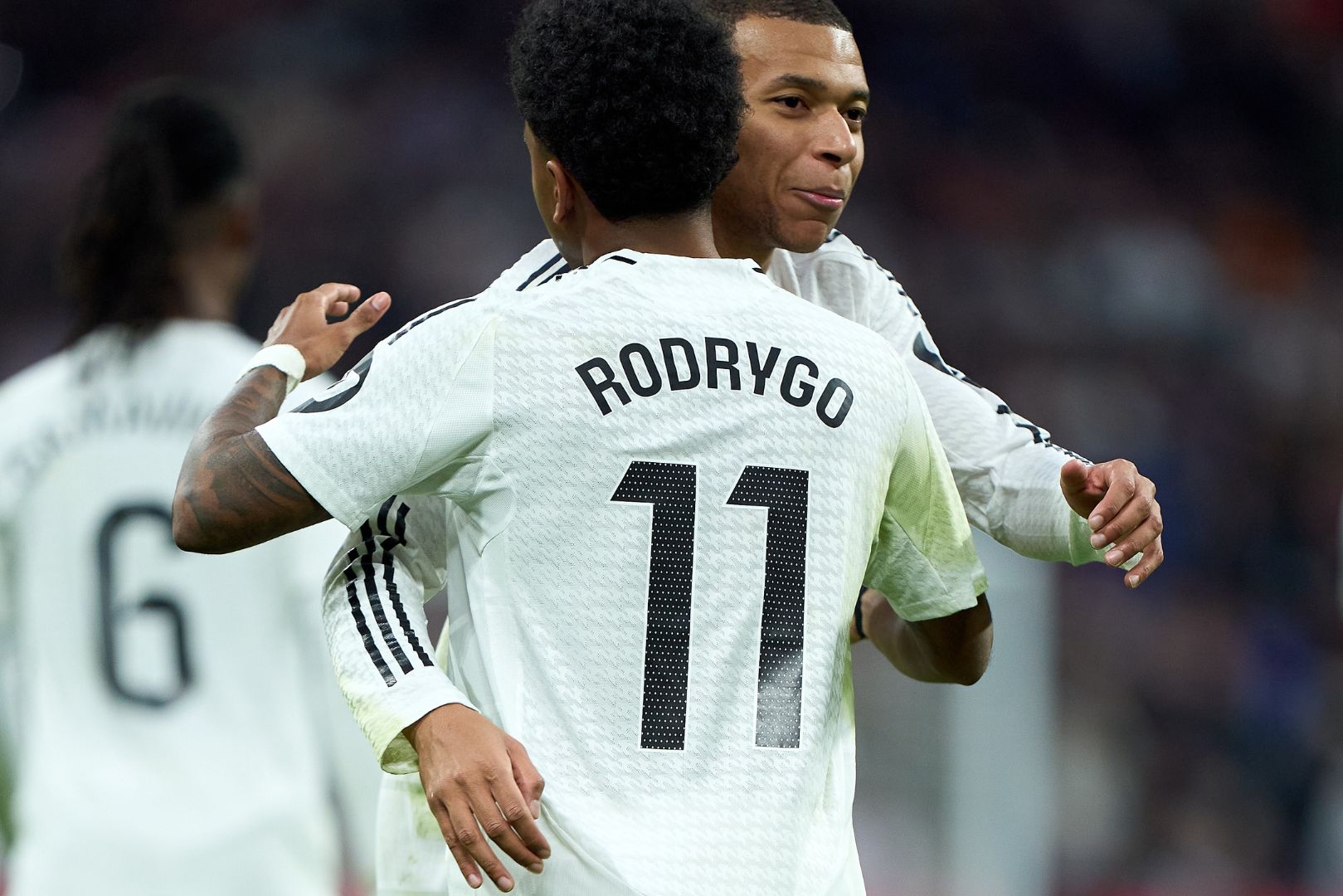 MADRID, SPAIN - DECEMBER 22: Rodrygo Goes of Real Madrid celebrates with Kylian Mbappe after scoring the team's third goal during the LaLiga match between Real Madrid CF and Sevilla FC at Estadio Santiago Bernabeu on December 22, 2024 in Madrid, Spain.