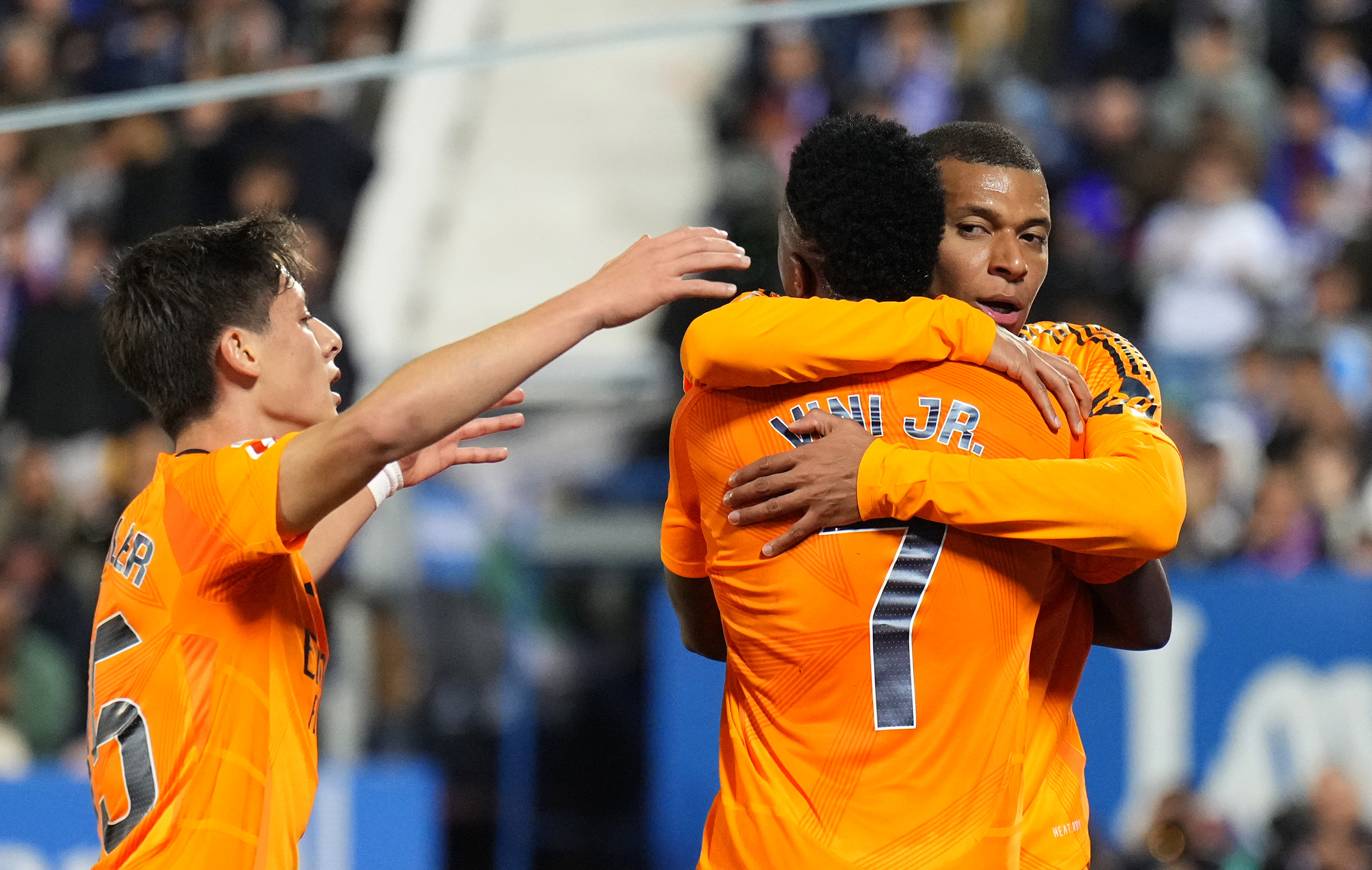 LEGANES, SPAIN - NOVEMBER 24: Kylian Mbappe of Real Madrid celebrates scoring his team's first goal with teammates Vinicius Junior and Arda Gueler during the LaLiga match between CD Leganes and Real Madrid CF at Estadio Municipal de Butarque on November 24, 2024 in Leganes, Spain.