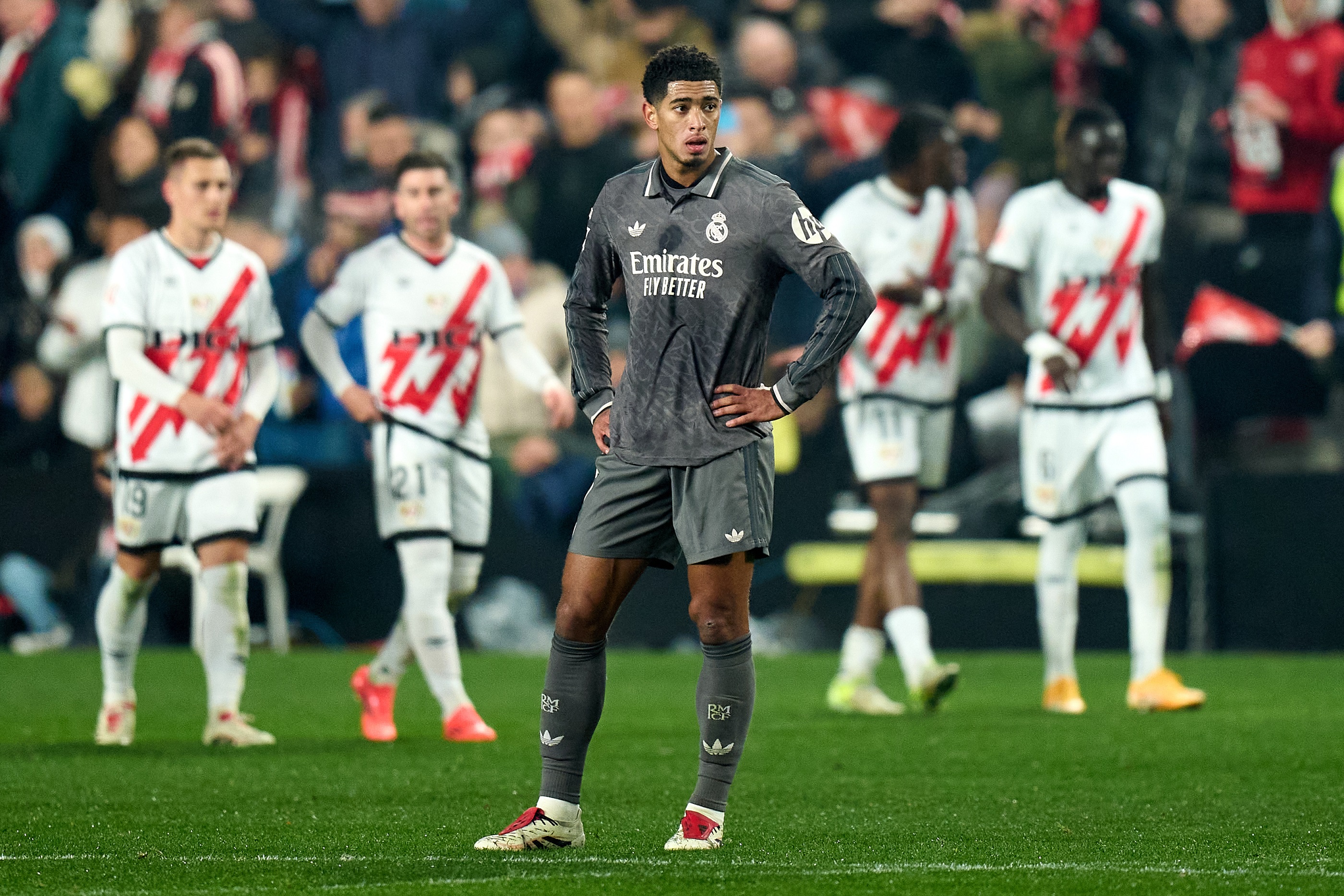 MADRID, SPAIN - DECEMBER 14: Jude Bellingham of Real Madrid appears dejected after Abdul Mumin of Rayo Vallecano scores his team's second goal during the LaLiga match between Rayo Vallecano and Real Madrid CF at Estadio de Vallecas on December 14, 2024 in Madrid, Spain.