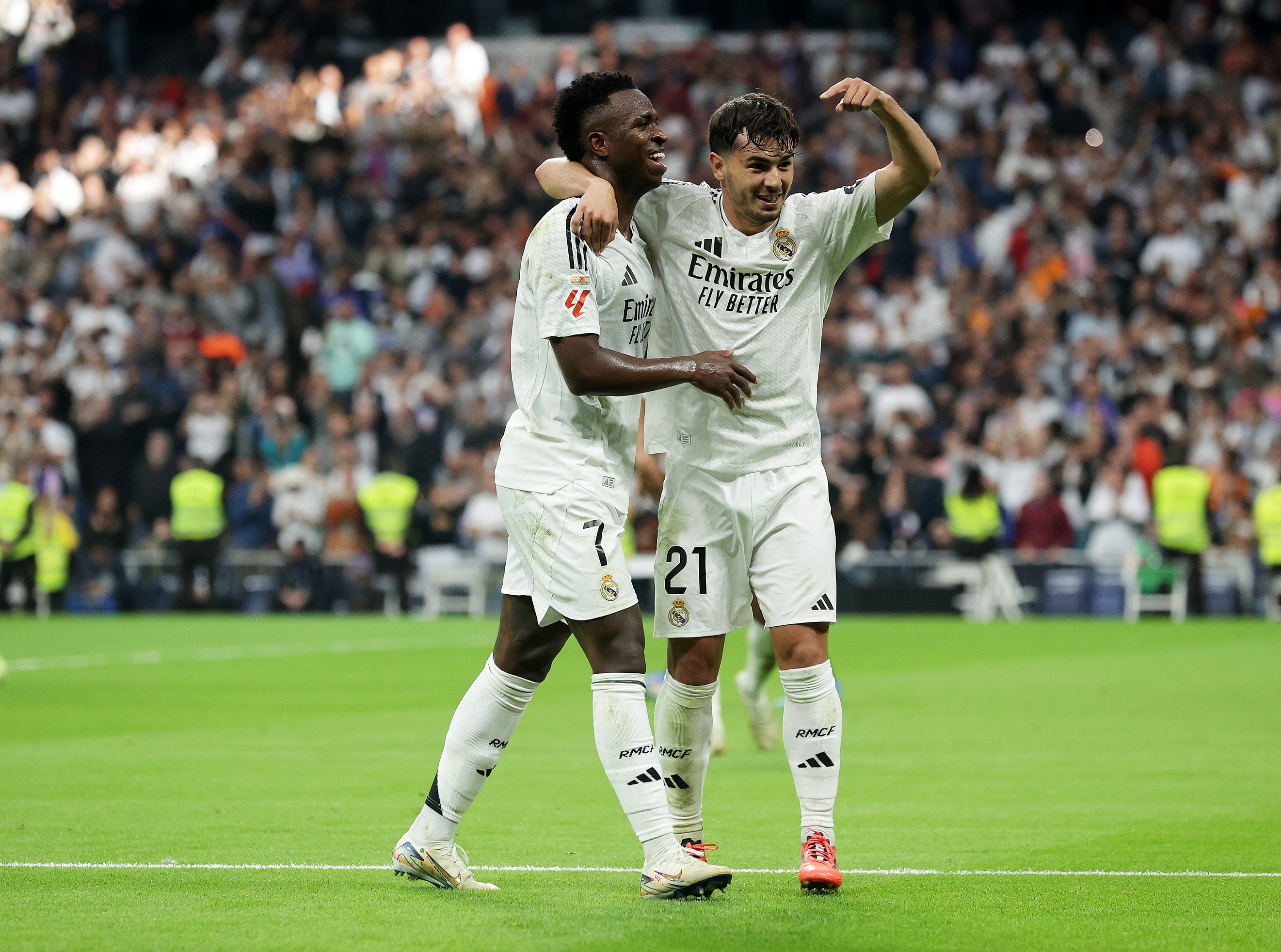 MADRID, SPAIN - NOVEMBER 09: Vinicius Junior of Real Madrid scores his team's third goal with teammate Brahim Diaz during the LaLiga match between Real Madrid CF and CA Osasuna at Estadio Santiago Bernabeu on November 09, 2024 in Madrid, Spain.