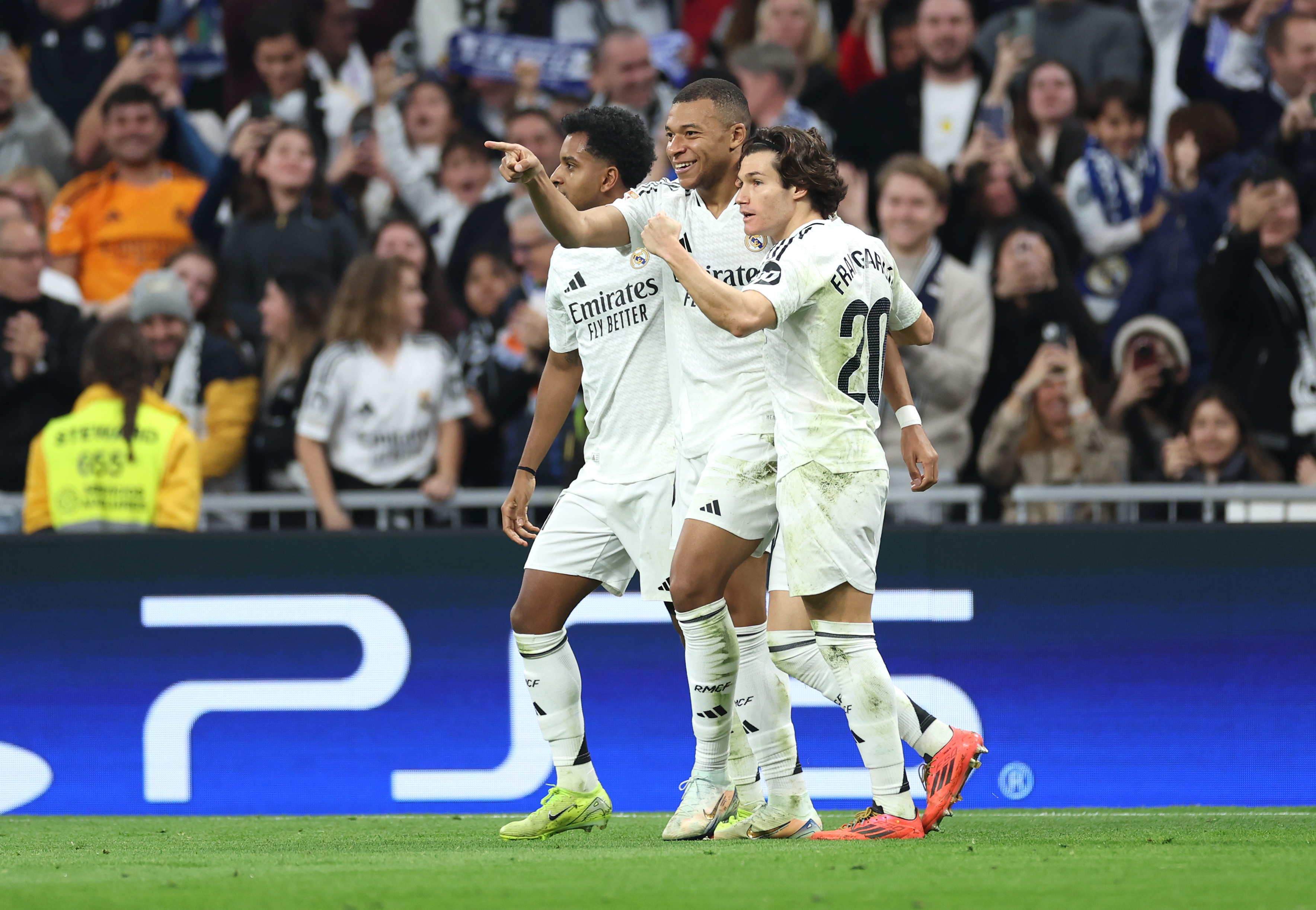 MADRID, SPAIN - DECEMBER 01: Kylian Mbappe of Real Madrid celebrates scoring his team's second goal with Rodrygo and Fran Garcia during the LaLiga match between Real Madrid CF and Getafe CF at Estadio Santiago Bernabeu on December 01, 2024 in Madrid, Spain.