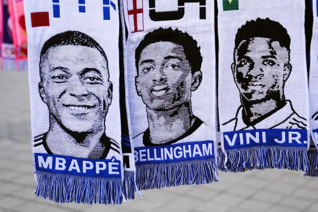 MADRID, SPAIN - MARCH 06: Scarves of Kylian Mbappe, Jude Bellingham and Vinicius Jr.hang in a souvenir stall outside the stadium prior to the UEFA Champions League 2023/24 round of 16 second leg match between Real Madrid CF and RB Leipzig at Estadio Santiago Bernabeu on March 06, 2024 in Madrid, Spain.