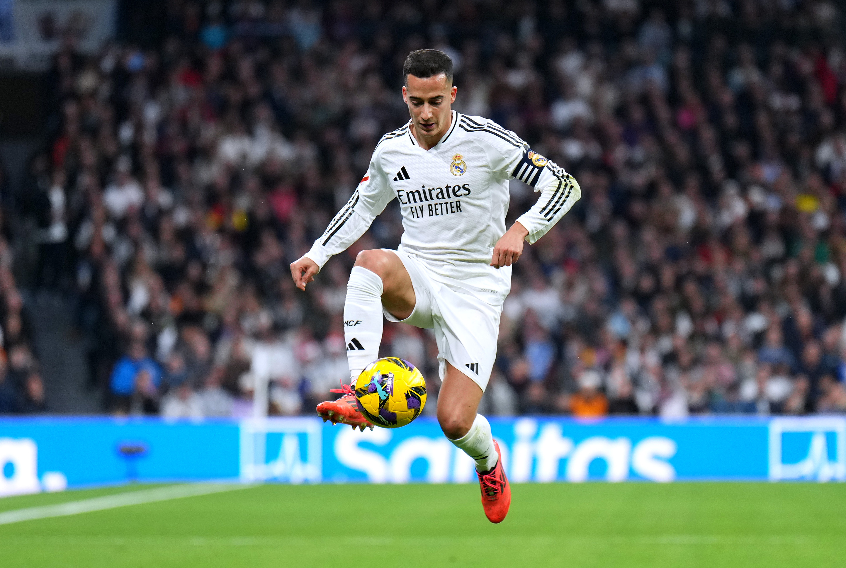 MADRID, SPAIN - DECEMBER 22: Lucas Vazquez of Real Madrid controls the ball during the LaLiga match between Real Madrid CF and Sevilla FC at Estadio Santiago Bernabeu on December 22, 2024 in Madrid, Spain.