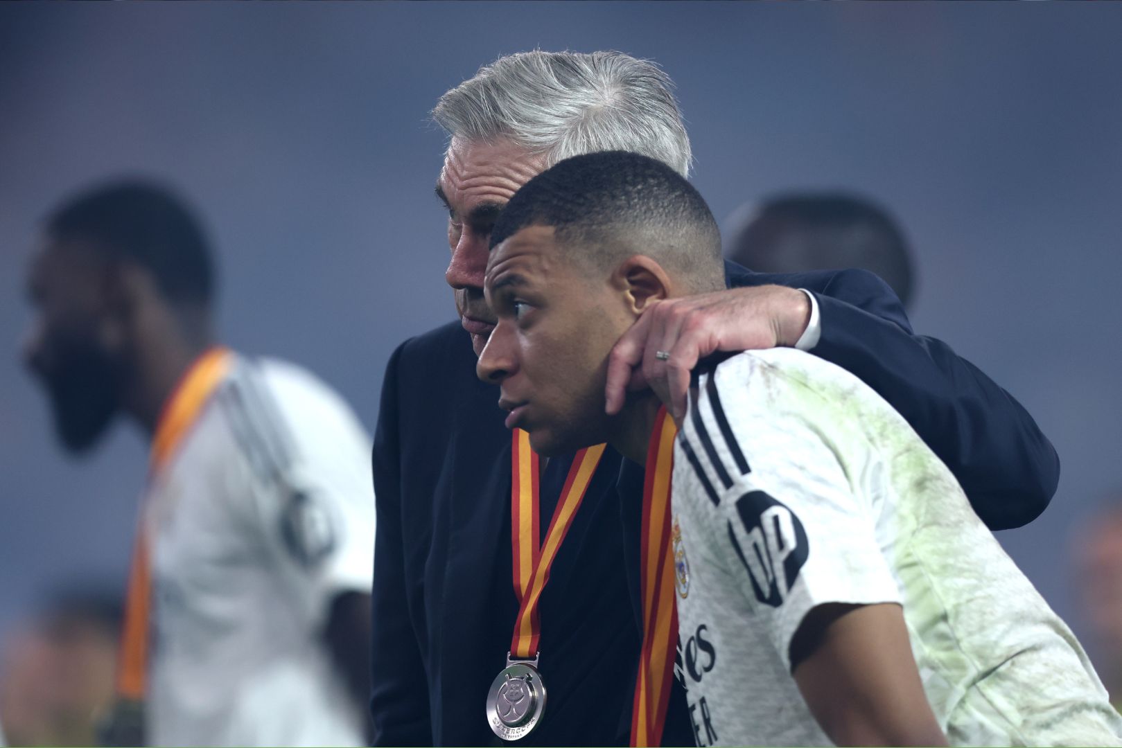 JEDDAH, SAUDI ARABIA - JANUARY 12: Carlo Ancelotti, Head Coach of Real Madrid, embraces Kylian Mbappe of Real Madrid during the trophy presentation after the Spanish Super Cup Final between Real Madrid and FC Barcelona at King Abdullah Sports City on January 12, 2025 in Jeddah, Saudi Arabia.