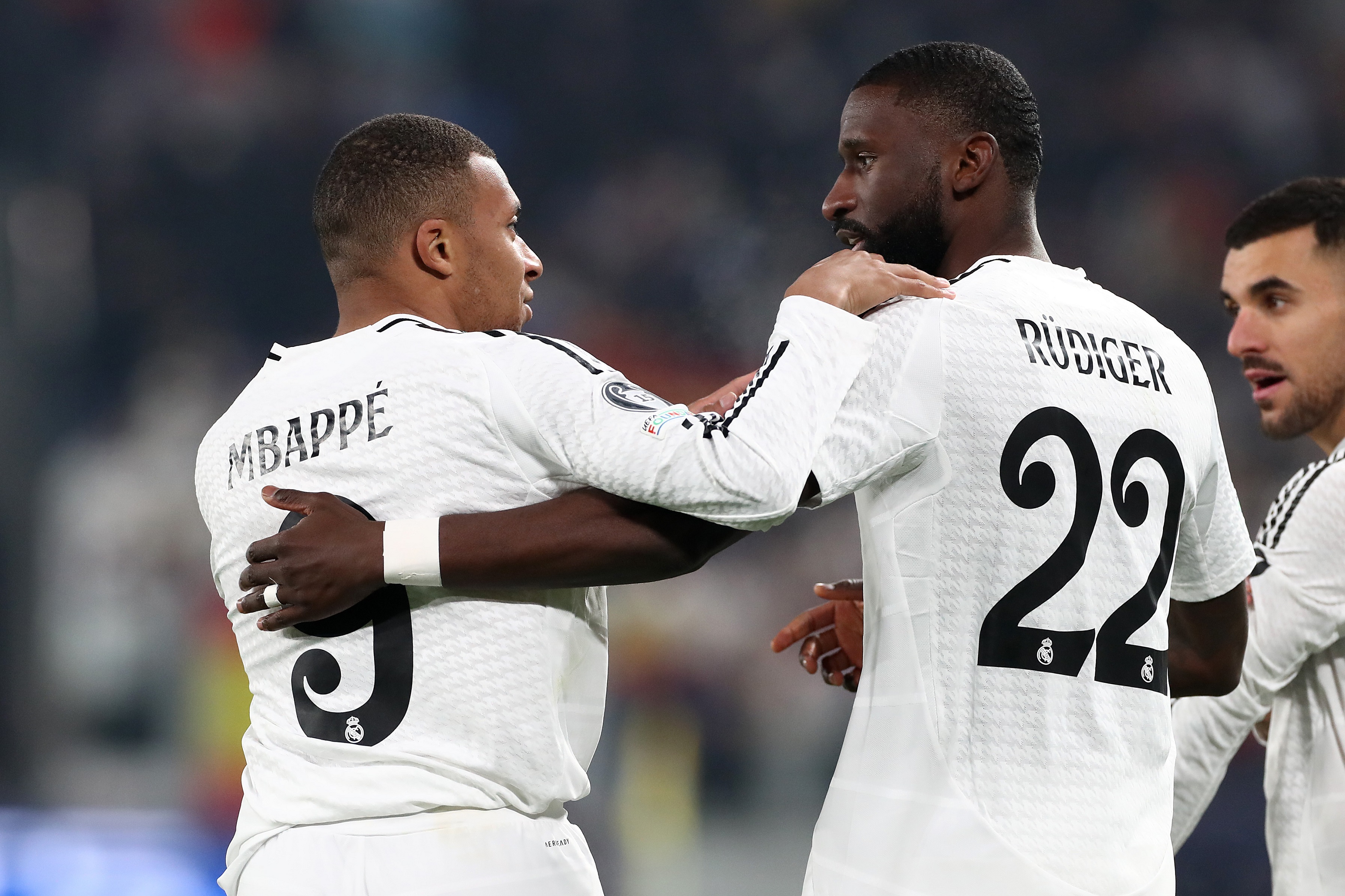 BERGAMO, ITALY - DECEMBER 10: Kylian Mbappe of Real Madrid celebrates with teammate Antonio Ruediger after scoring his team's first goal during the UEFA Champions League 2024/25 League Phase MD6 match between Atalanta BC and Real Madrid C.F. at Stadio di Bergamo on December 10, 2024 in Bergamo, Italy.