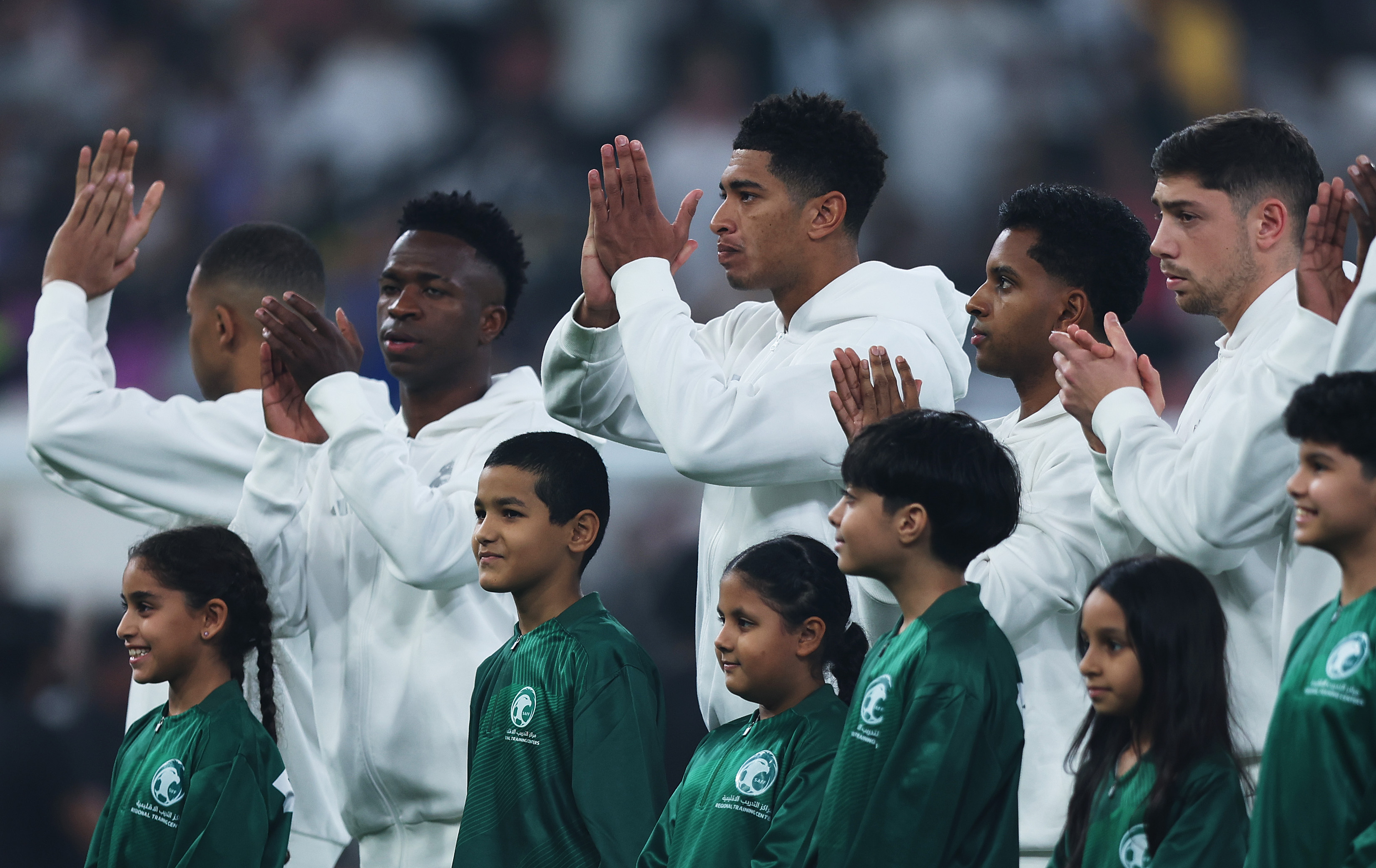 JEDDAH, SAUDI ARABIA - JANUARY 09: Vinicius Junior, Jude Bellingham, Rodrygo and Federico Valverde of Real Madrid line up on the pitch prior to the Spanish Super Cup Semi-Final match between Real Madrid and RCD Mallorca at King Abdullah Sports City on January 09, 2025 in Jeddah, Saudi Arabia.