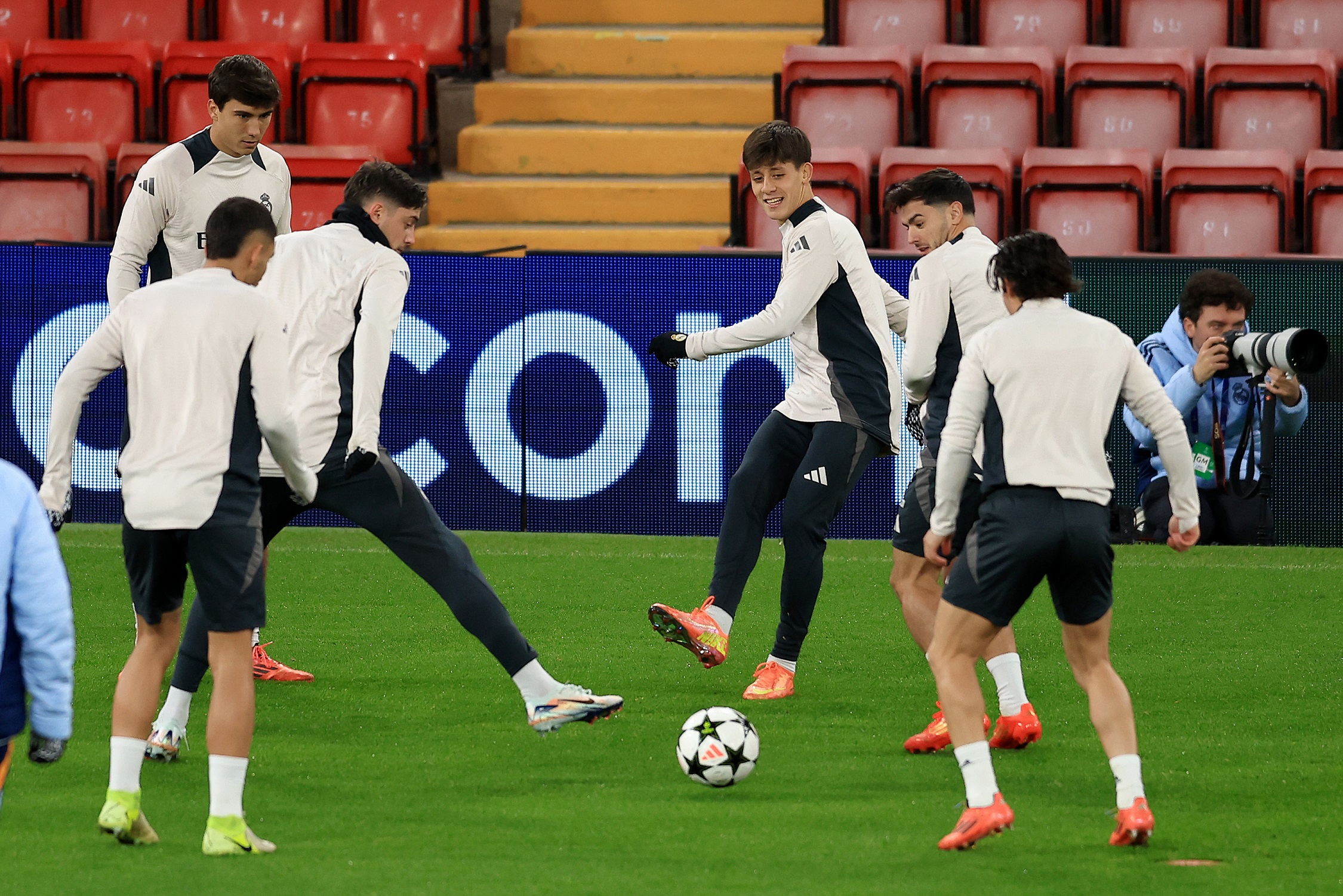 LIVERPOOL, ENGLAND - NOVEMBER 26: Arda Gueler of Real Madrid passes the ball as he warms up with teammates during the UEFA Champions League 2024/25 League Phase MD5 training and press conference at Anfield on November 26, 2024 in Liverpool, England.