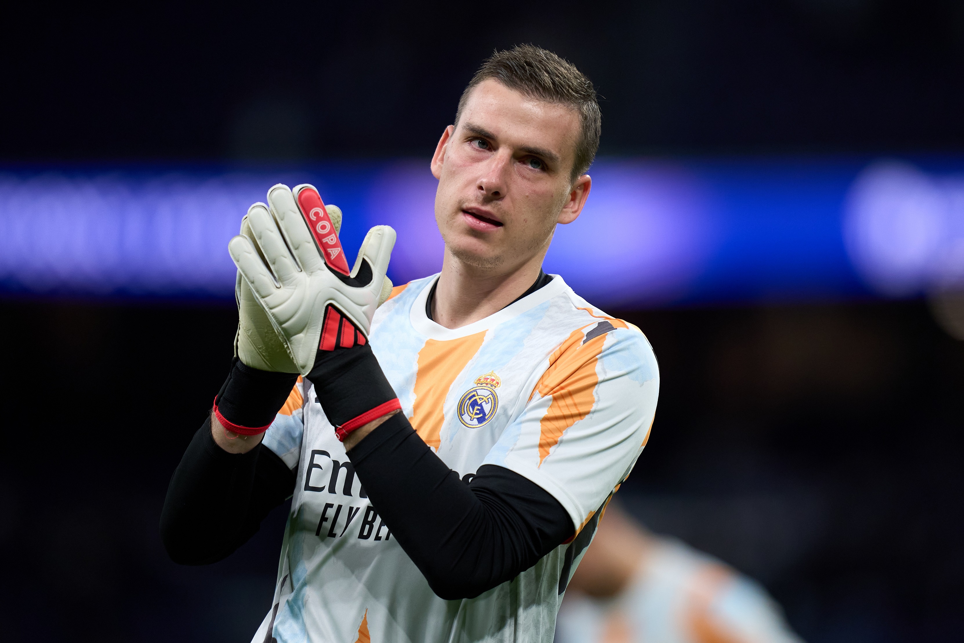 MADRID, SPAIN - JANUARY 22: Andriy Lunin of Real Madrid applauds the fans as he warms up prior to the UEFA Champions League 2024/25 League Phase MD7 match between Real Madrid C.F. and FC Salzburg at Estadio Santiago Bernabeu on January 22, 2025 in Madrid, Spain.