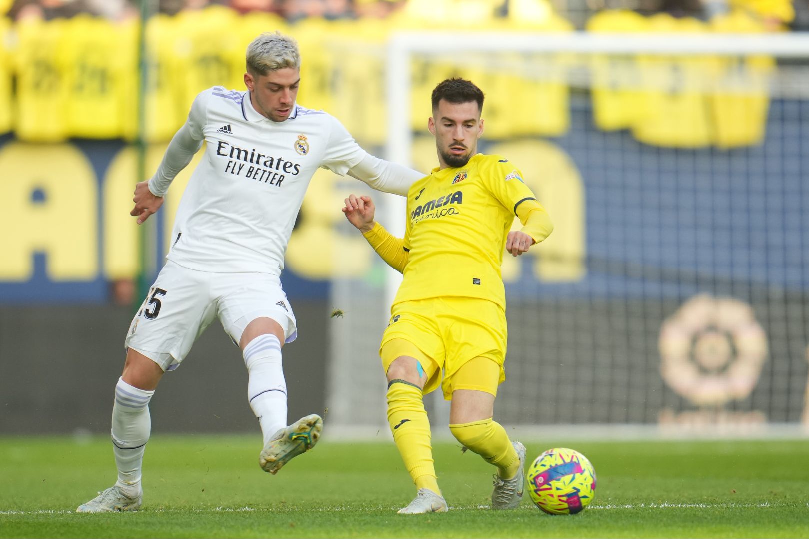 VILLARREAL, SPAIN - JANUARY 07: Alex Baena of Villarreal CF is challenged by Federico Valverde of Real Madrid during the LaLiga Santander match between Villarreal CF and Real Madrid CF at Estadio de la Ceramica on January 07, 2023 in Villarreal, Spain.