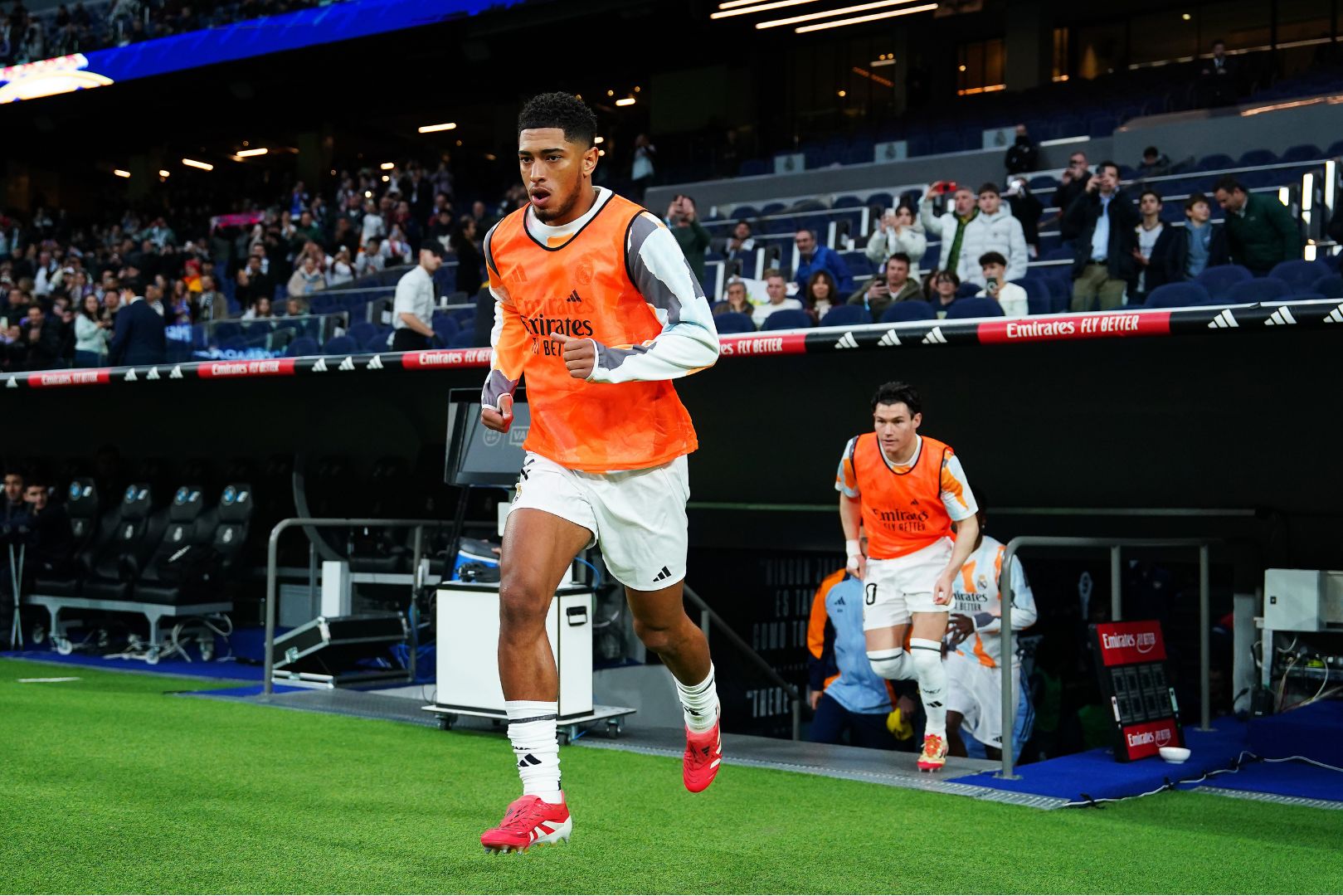 MADRID, SPAIN - MARCH 09: Jude Bellingham of Real Madrid enters the pitch for the warm up prior to the LaLiga match between Real Madrid CF and Rayo Vallecano at the Estadio Santiago Bernabeu on March 09, 2025 in Madrid, Spain.