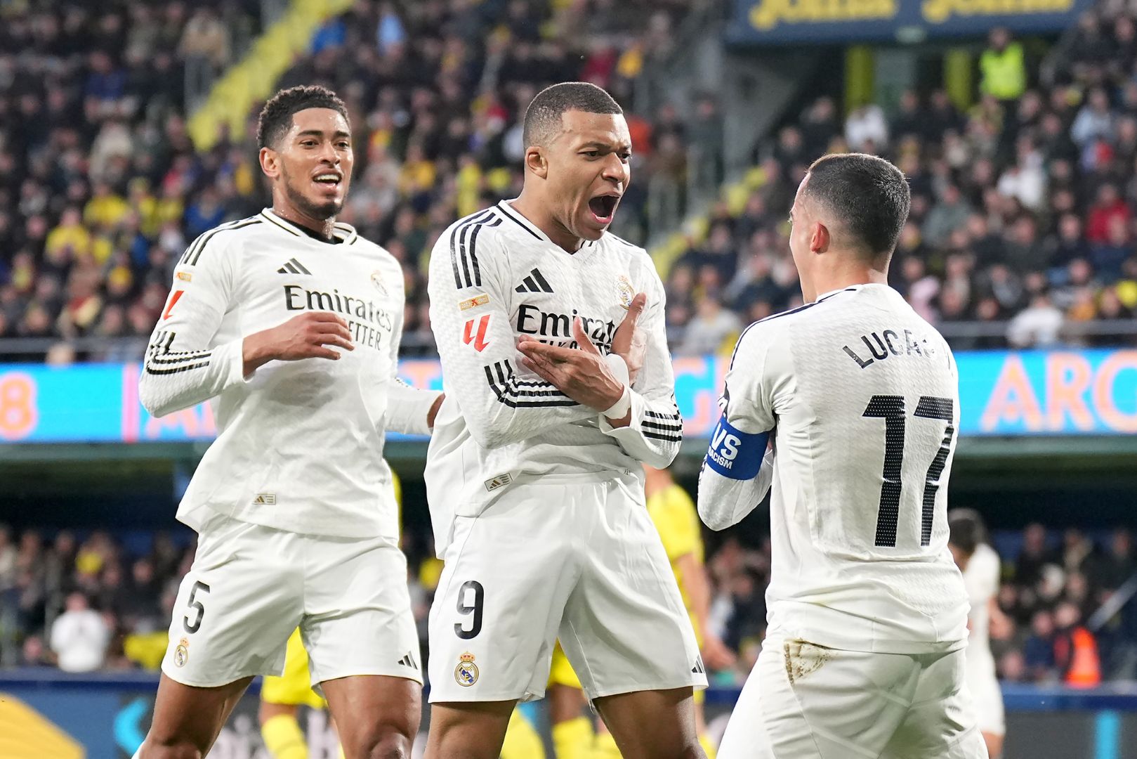 VILLARREAL, SPAIN - MARCH 15: Kylian Mbappe of Real Madrid celebrates scoring his team's second goal with teammates Jude Bellingham and Lucas Vazquez during the LaLiga match between Villarreal CF and Real Madrid CF at Estadio de la Ceramica on March 15, 2025 in Villarreal, Spain.