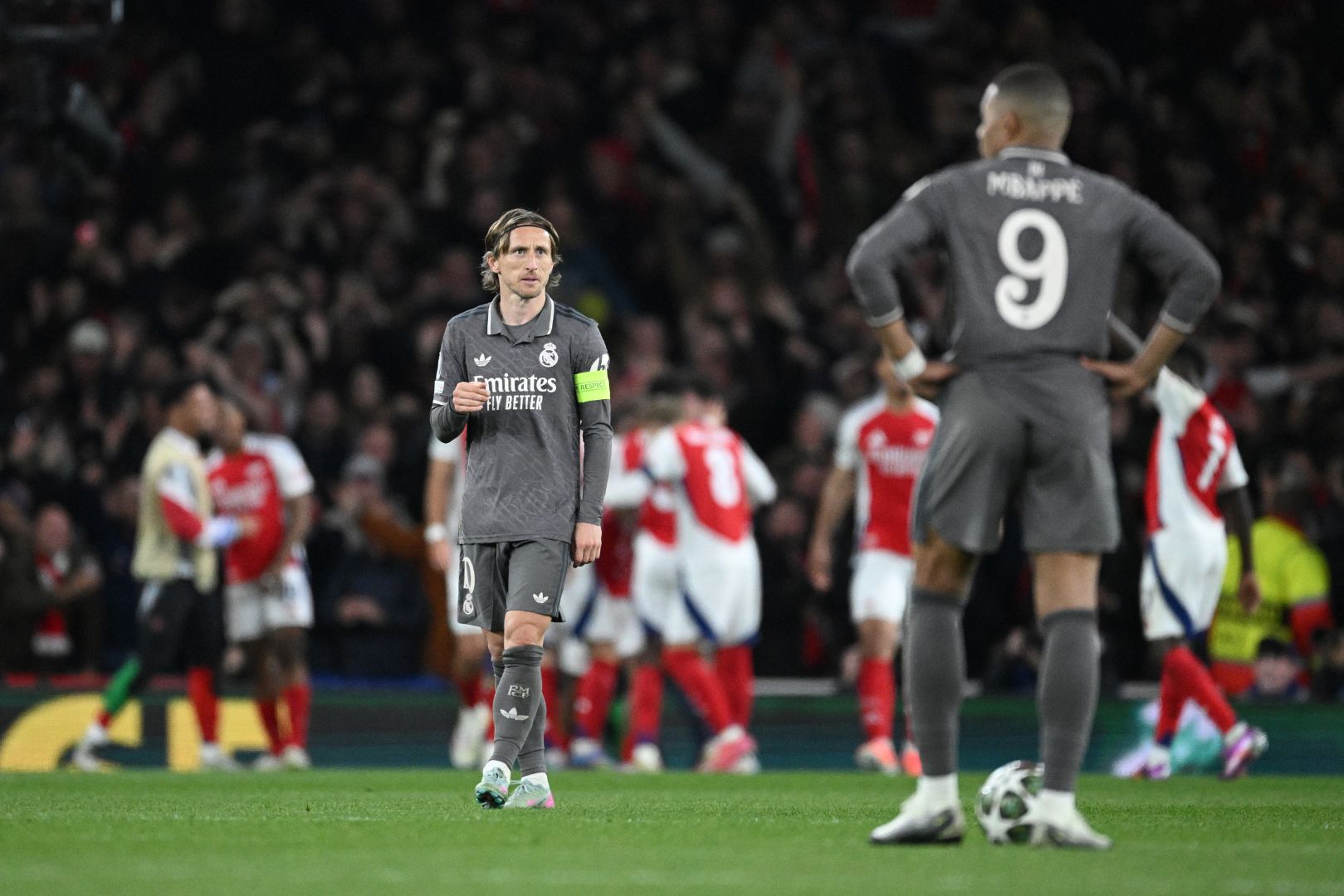 LONDON, ENGLAND - APRIL 08: Luka Modric of Real Madrid looks on after Declan Rice of Arsenal (obscured) scores his team's second goal during the UEFA Champions League 2024/25 Quarter Final First Leg match between Arsenal FC and Real Madrid C.F. at Emirates Stadium on April 08, 2025 in London, England.