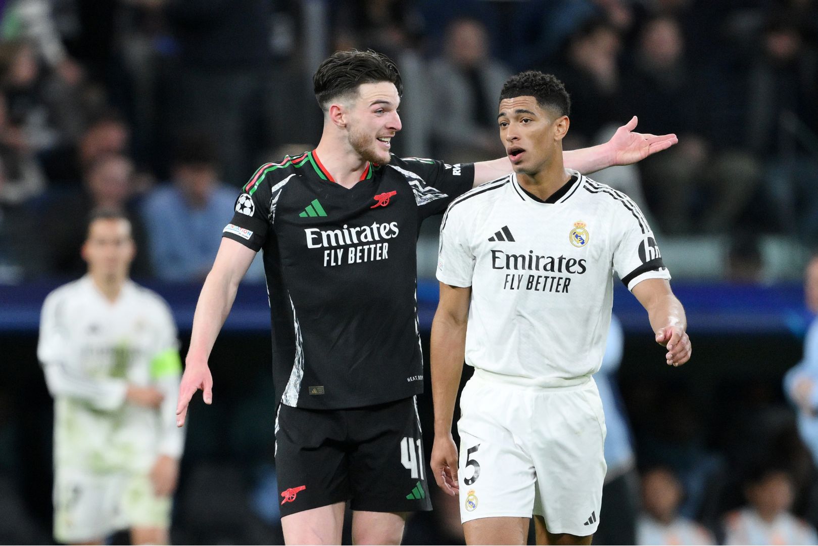 MADRID, SPAIN - APRIL 16: Declan Rice of Arsenal speaks to Jude Bellingham of Real Madrid during the UEFA Champions League 2024/25 Quarter Final Second Leg match between Real Madrid C.F. and Arsenal FC at Estadio Santiago Bernabeu on April 16, 2025 in Madrid, Spain.