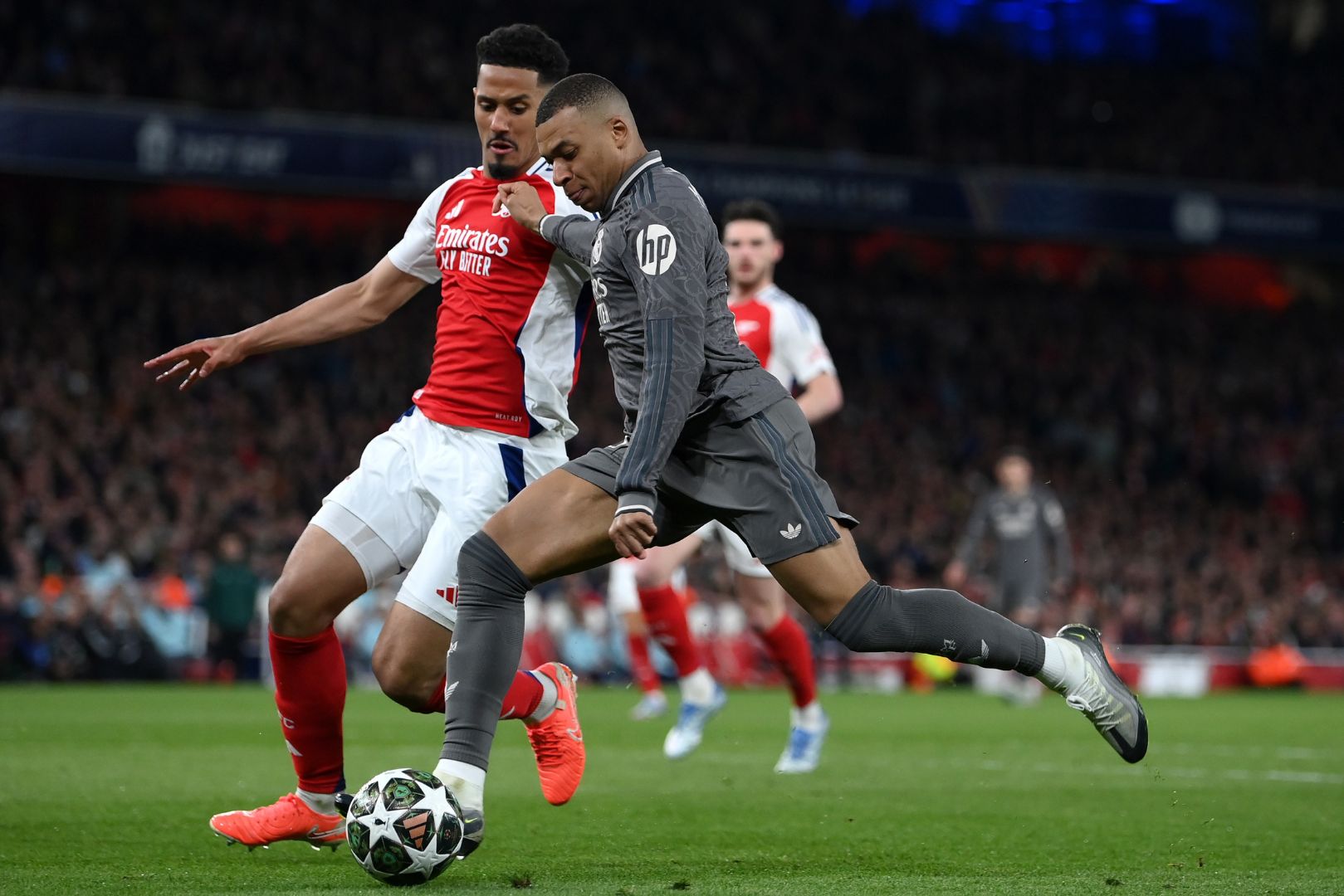 LONDON, ENGLAND - APRIL 08: Kylian Mbappe of Real Madrid holds off ars during the UEFA Champions League 2024/25 Quarter Final First Leg match between Arsenal FC and Real Madrid C.F. at Arsenal Stadium on April 08, 2025 in London, England.