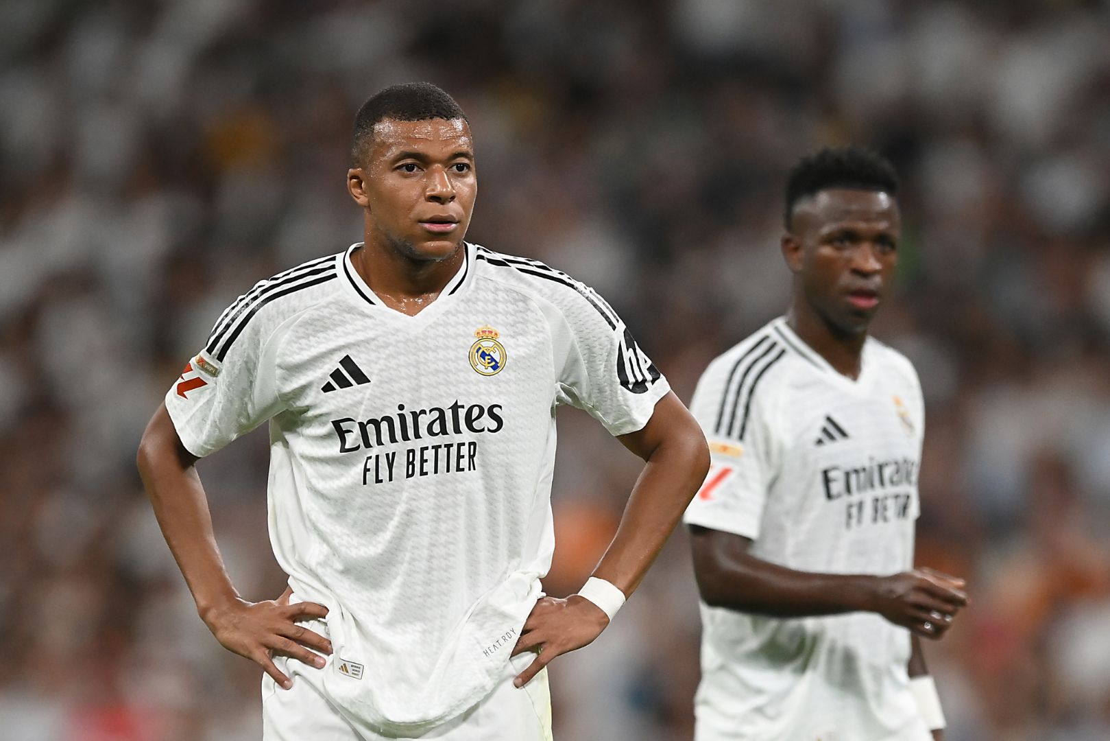 MADRID, SPAIN - SEPTEMBER 01: Kylian Mbappe of Real Madrid looks on with teammate Vinicius Junior during the LaLiga match between Real Madrid CF and Real Betis Balompie at Estadio Santiago Bernabeu on September 01, 2024 in Madrid, Spain.