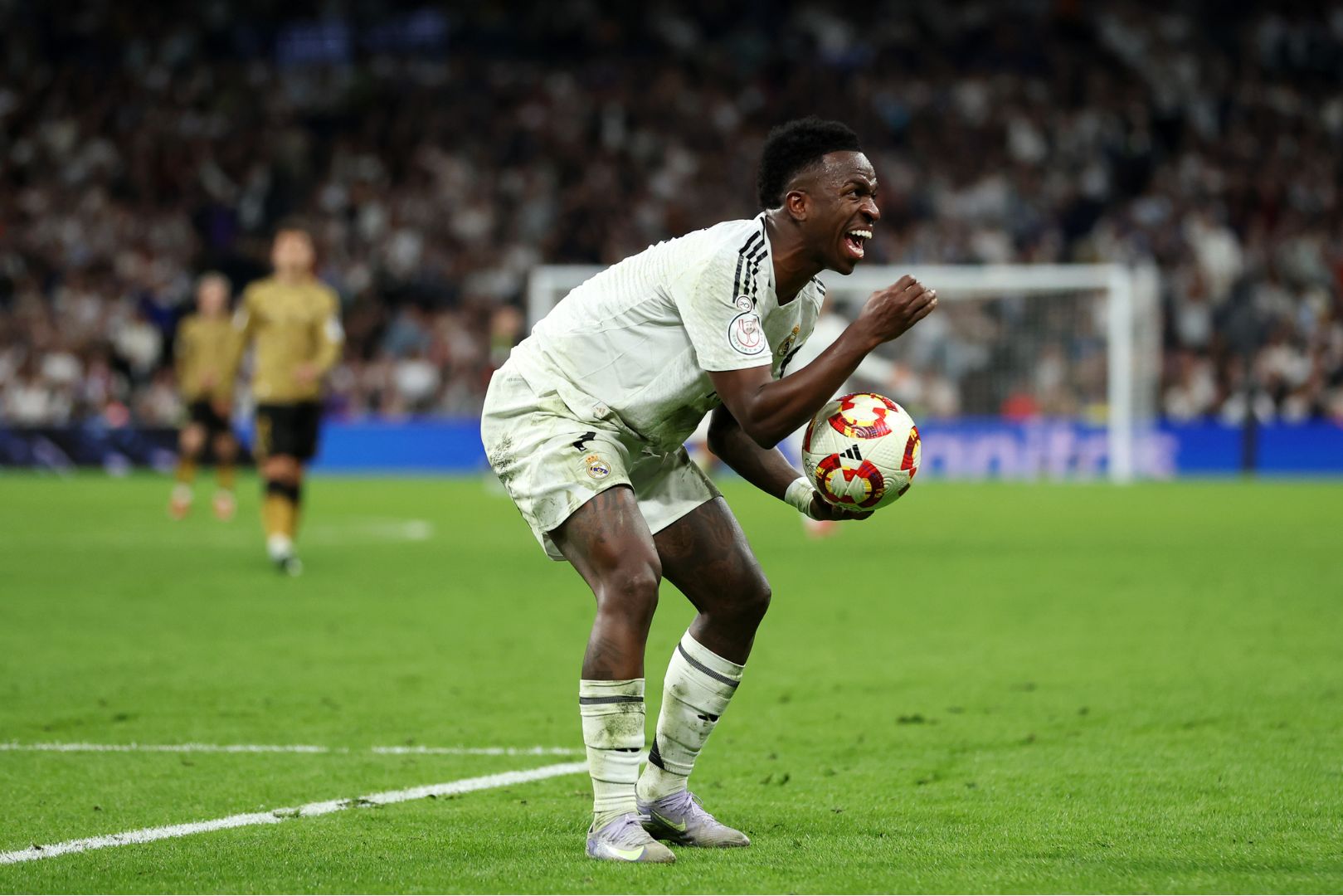 MADRID, SPAIN - APRIL 01: Vinicius Junior of Real Madrid reacts during the Copa del Rey semifinal match between Real Madrid and Real Sociedad at Estadio Santiago Bernabeu on April 01, 2025 in Madrid, Spain.