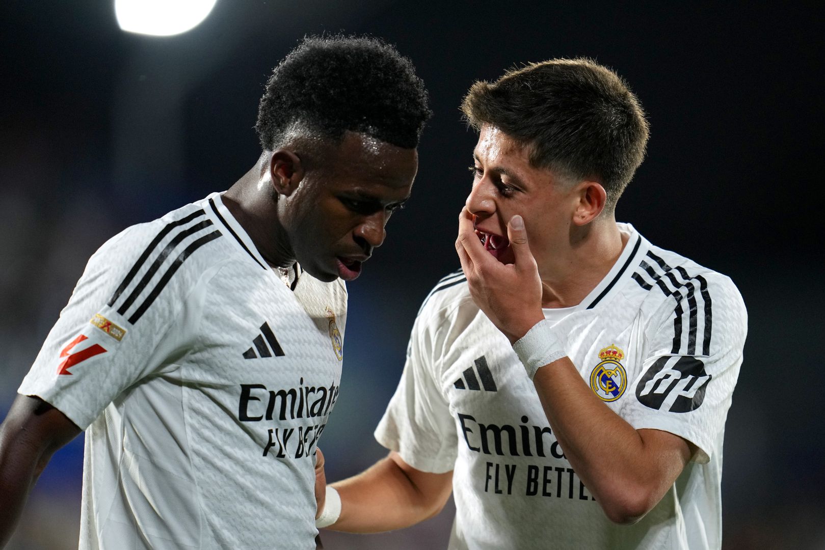 GETAFE, SPAIN - APRIL 23: Arda Gueler of Real Madrid interacts with teammate Vinicius Junior during the LaLiga match between Getafe CF and Real Madrid CF at Coliseum Alfonso Perez on April 23, 2025 in Getafe, Spain.